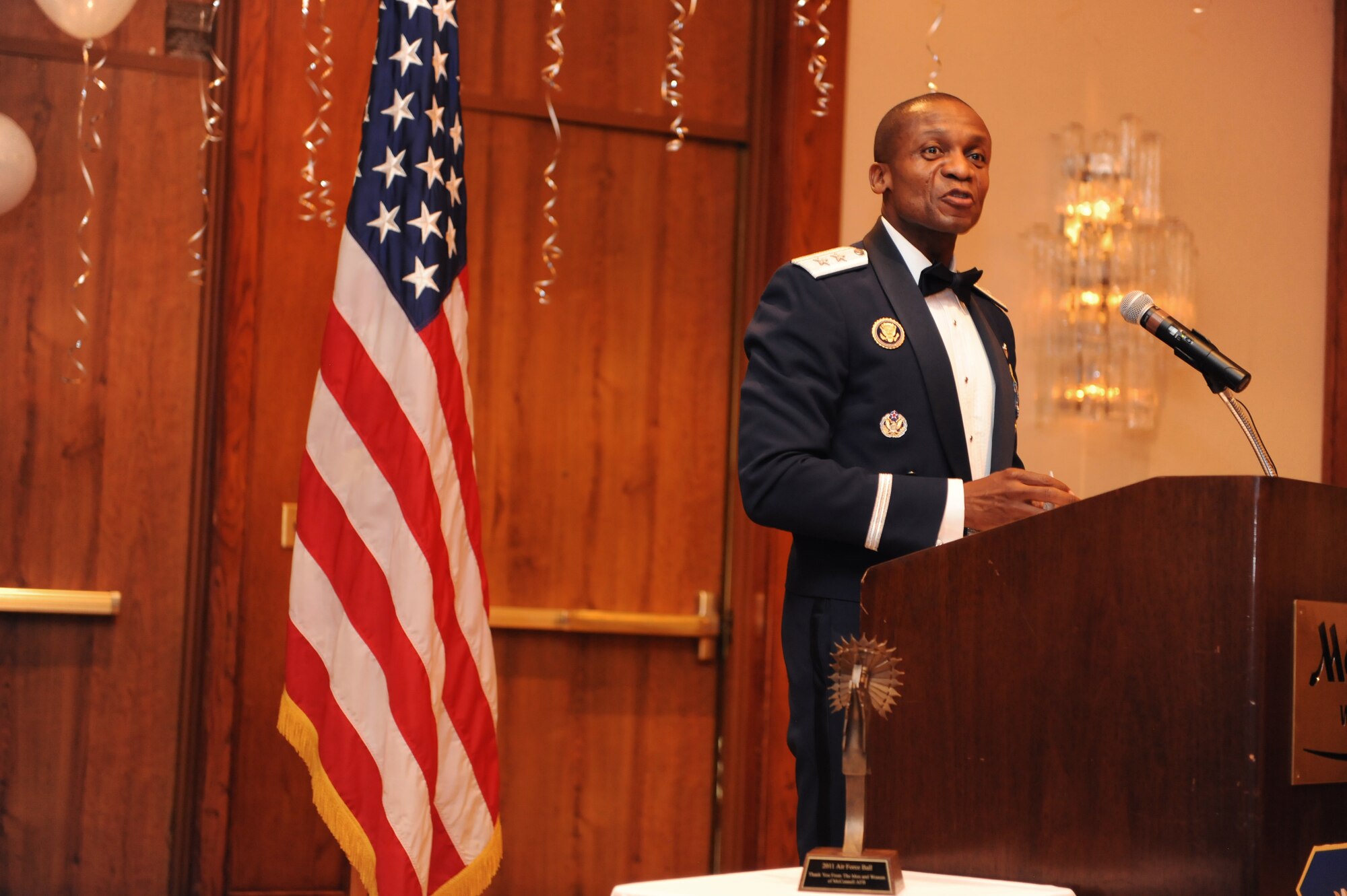Maj. Gen. Darren McDew, Air Force District of Washington commander, speaks to the crowd at the 2011 Air Force Ball.  The ball is an annual Air Force-wide tradition to celebrate the heritage and history of the Air Force. McConnell celebrates semi-annually.  (U.S. Air Force photo/Airman 1st Class Katrina Brisbin)