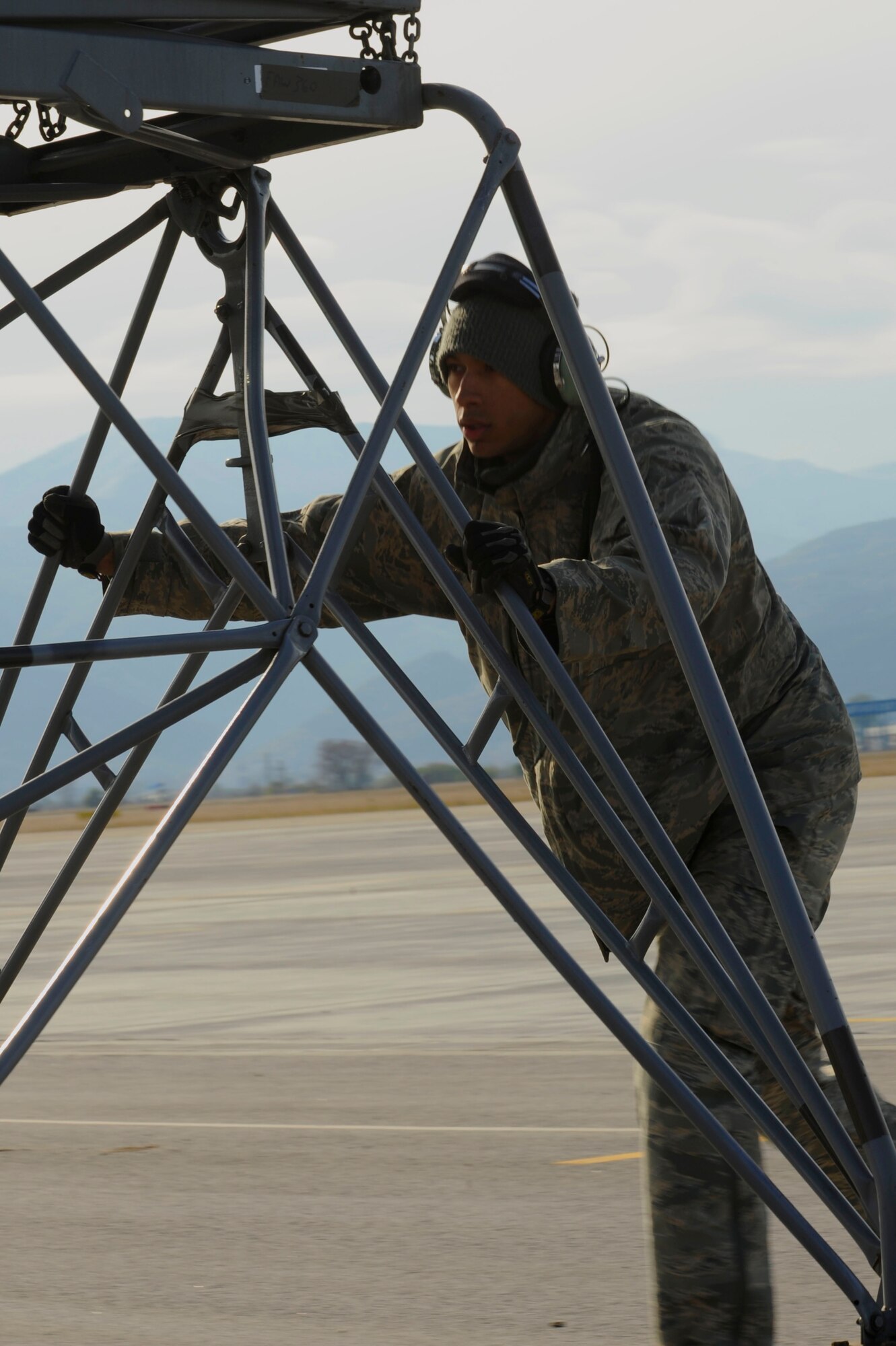 Staff Sgt. John-Moses Robinson, 86th Aircraft Maintenance Squadron defensive systems technician, from Ramstein Air Base, Germany, moves an engine maintenance stand off the flight line during Operation Thracian Fall 2011, Oct. 18, 2011 in Plovdiv, Bulgaria. Thracian Fall is an off-station training exercise designed to enhance interoperability between U.S. and Bulgarian Air Forces as well as build partnerships with paratroopers from both. (U.S. Air Force photo by Senior Airman Stephen J. Otero)