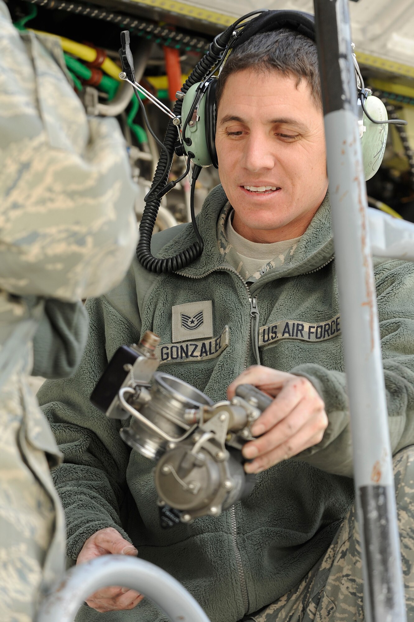Tech. Sgt. Ramiro Gonzalez, 86th Aircraft Maintenance Squadron propulsion systems mechanic, from Ramstein Air Base, Germany, holds a broken starter-control valve from a C-130J Super Hercules engine during Operation Thracian Fall 2011, Oct. 18, 2011 in Plovdiv, Bulgaria. OTF11 is an off-station training exercise designed to enhance interoperability between U.S. and Bulgarian Air Forces as well as build partnerships with paratroopers from both. (U.S. Air Force photo by Senior Airman Stephen J. Otero)