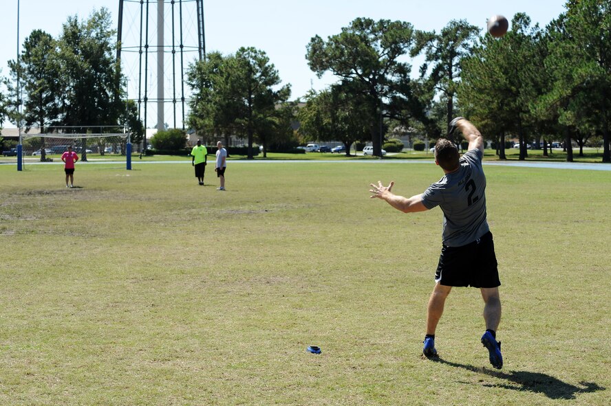 An Airman passes the football during the Pass, Punt and Kick Challenge for Super Sports Day at Moody Air Force Base, Ga., Oct. 14, 2011. The winner was determined by highest cumulative yards passed, punted, and kicked. Super Sports Day is an annual event that features different sporting activities for Team Moody to participate in. (U.S. Air Force photo by Senior Airman Ciara Wymbs/Released) 