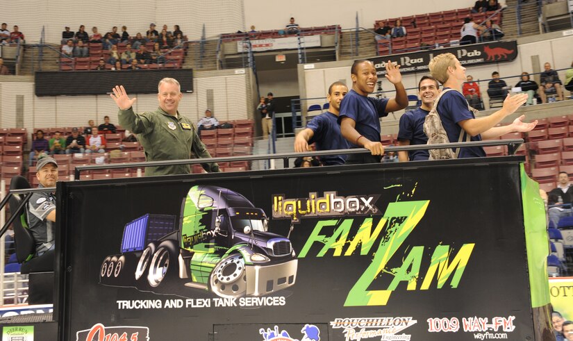 Colonel Erik Hansen waves to the crowd as he rides the "Fan Zam" during an intermission at the Stingrays Hockey Game Military Appreciation Night at the North Charleston Coliseum, Oct. 15. Hansen is the 437th Airlift Wing commander. (U.S. Air Force photo/Airman 1st Class Ashlee Galloway)