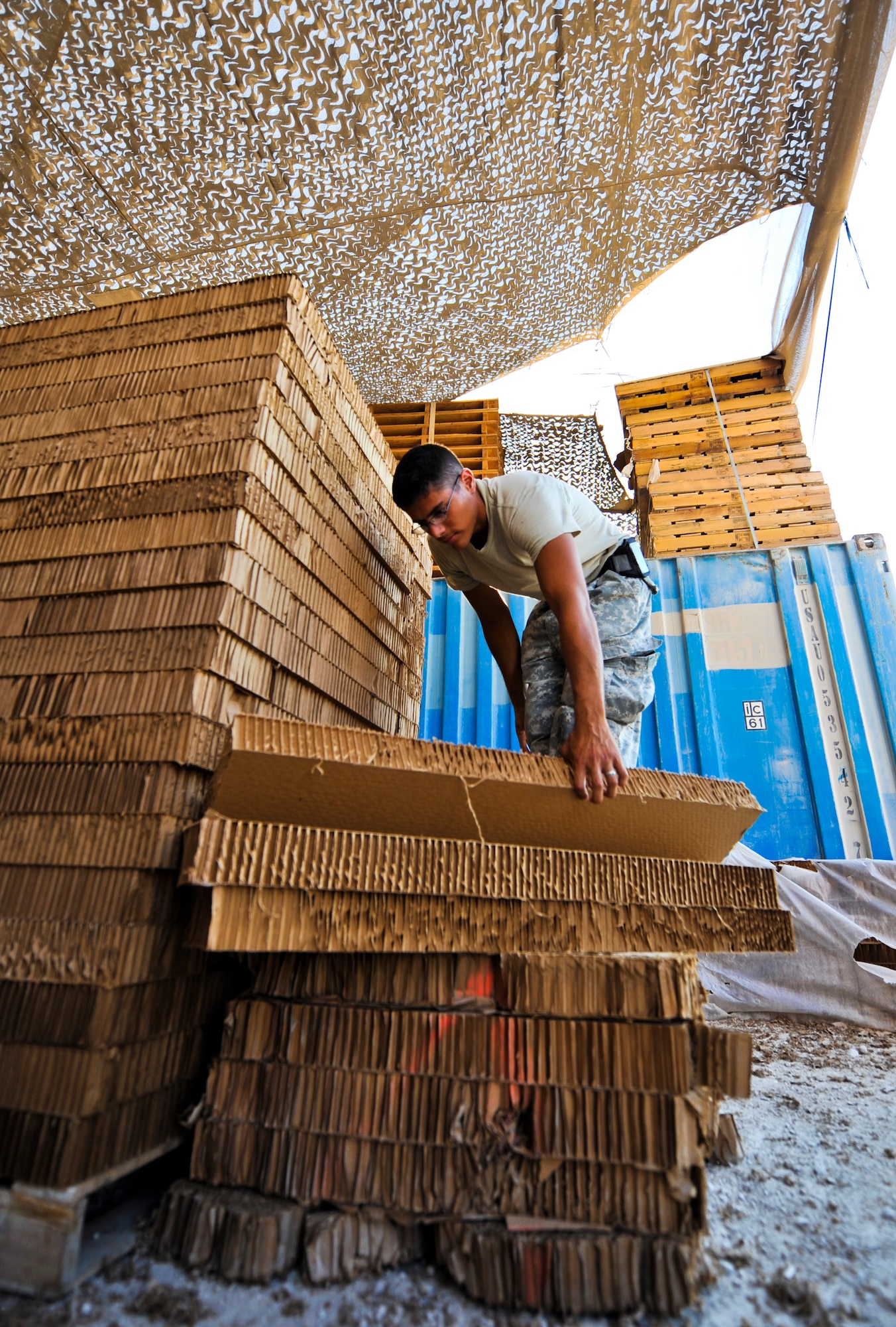 Spc. Andrew Jimenez, 824th Quartermaster Company Det. 10 wood fabrication technician, stacks honeycomb packing material used for ventilation, energy dissipation and cushioning of materials to be delivered by air Oct. 14, 2011, at an undisclosed location in Southwest Asia. Jimenez, a native of Gleason, Wis., is deployed from the U.S. Army Reserve's 861st Quartermaster Company in Nashville, Tenn. (U.S. Air Force photo/Senior Airman Paul Labbe) 