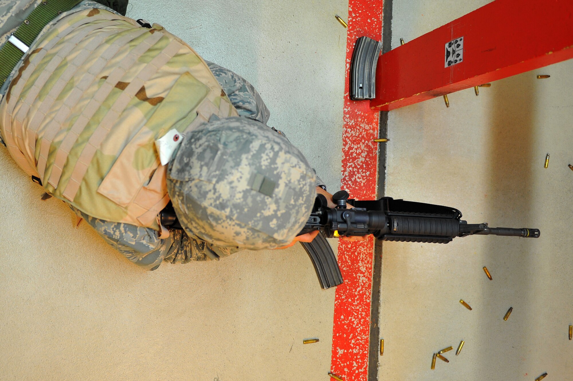 SPANGDAHLEM AIR BASE, Germany – Major Gerald Stevenson, 52nd Comptroller Squadron commander, switches magazines on an M-4 assault rifle during the new weapons qualification course here Oct. 13. Air Force leadership modernized the rifle qualification course by adding movement while engaging targets to better train and equip Airmen for today’s fight. Spangdahlem AB is the first base in United States Air Forces in Europe to initiate the new qualification course. (U.S. Air Force photo/Airman 1st Class Dillon Davis)