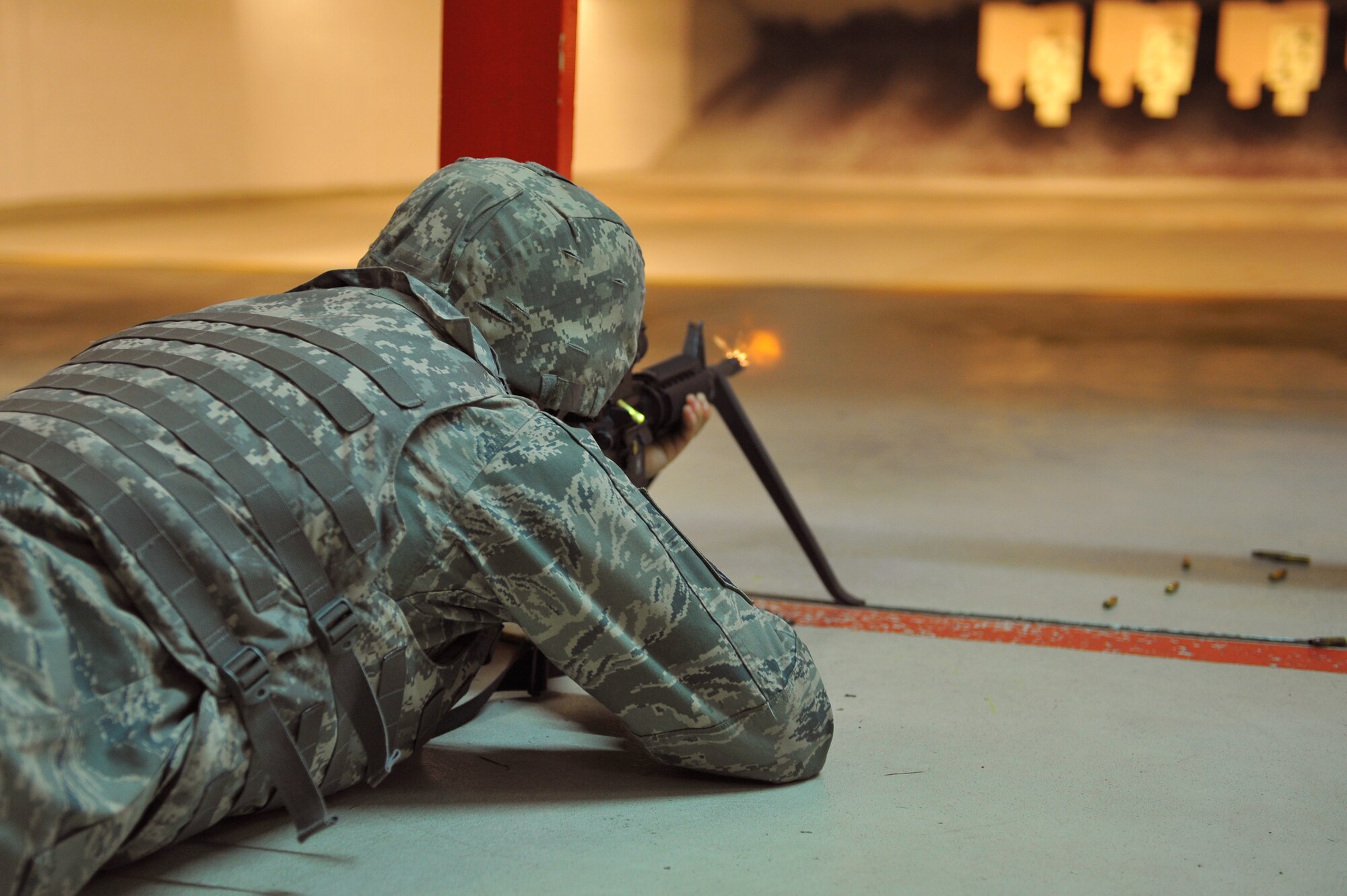 SPANGDAHLEM AIR BASE, Germany – Chief Master Sgt. Christopher Lantagne, 52nd Medical Group group superintendent, fires an M-4 assault rifle during the new weapons qualification course here Oct. 13. Air Force leadership modernized the rifle qualification course by adding movement while engaging targets to better train and equip Airmen for today’s fight. Spangdahlem AB is the first base in United States Air Forces in Europe to initiate the new qualification course. (U.S. Air Force photo/Airman 1st Class Dillon Davis)