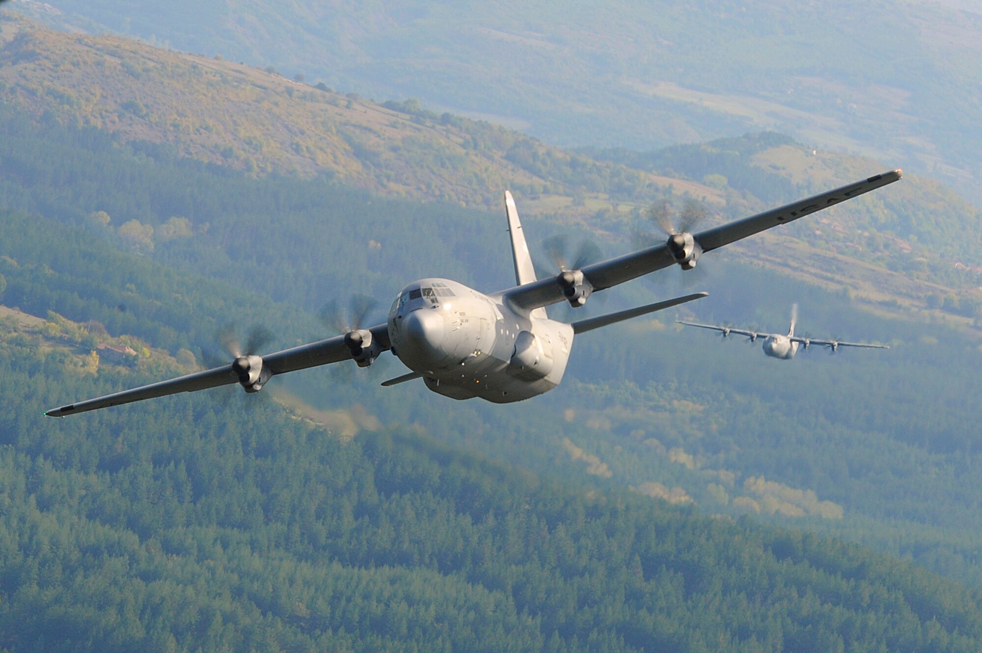U.S. Air Force C-130J Super Hercules assigned to the 37th Airlift Squadron, Ramstein Air Base, Germany, conduct low level flight training during Operation Thracian Fall 2011, Oct. 18, 2011, Plovdiv, Bulgaria. OTF11 is off-station training designed to enhance interoperability between U.S. and Bulgarian Air Forces as well as build partnerships with paratroopers from both. (U.S. Air Force photo by Senior Airman Stephen J. Otero)