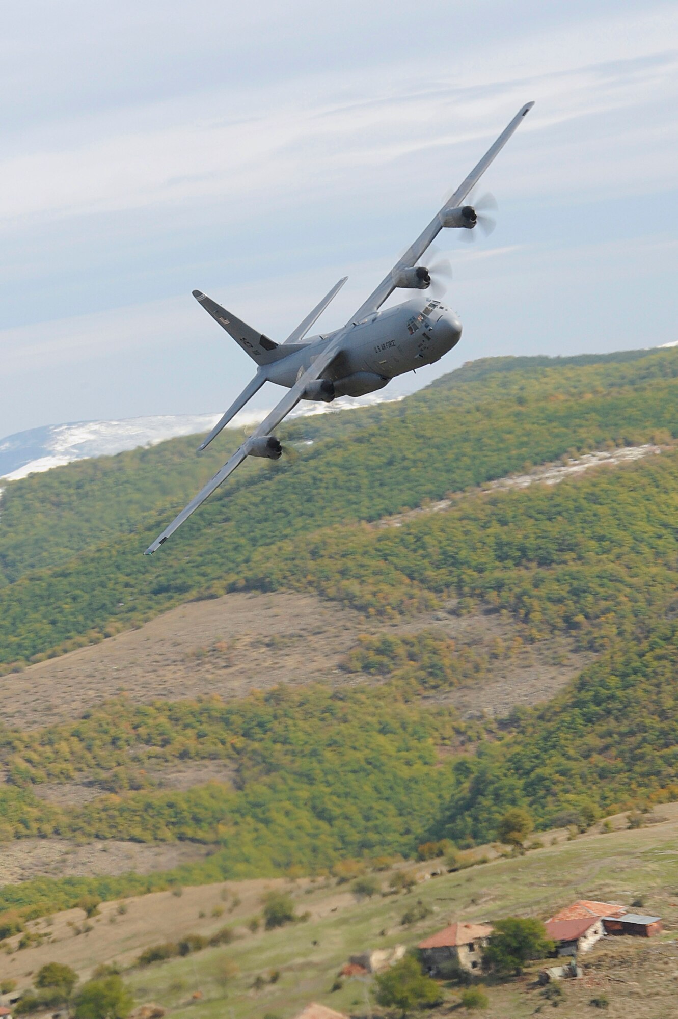 A U.S. Air Force C-130J Super Hercules assigned to the 37th Airlift Squadron, Ramstein Air Base, Germany, conducts low-level flight training during Operation Thracian Fall 2011, Oct. 18, 2011, in Plovdiv, Bulgaria. OTF11 is off-station training designed to enhance interoperability between U.S. and Bulgarian Air Forces as well as build partnerships with paratroopers from both. (U.S. Air Force photo by Senior Airman Stephen J. Otero)