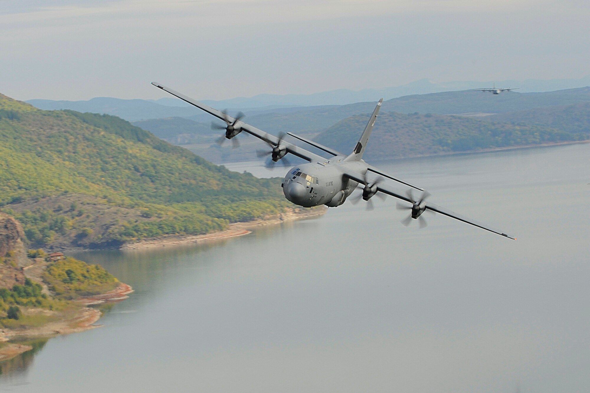 A C-130J Super Hercules assigned to the 37th Airlift Squadron, Ramstein Air Base, Germany, conducts low level flight training during Operation Thracian Fall 2011, Oct. 18, 2011 in Plovdiv, Bulgaria. OTF11 is off-station training designed to enhance interoperability between U.S. and Bulgarian Air Forces as well as build partnerships with paratroopers from both. (U.S. Air Force photo by Senior Airman Stephen J. Otero)