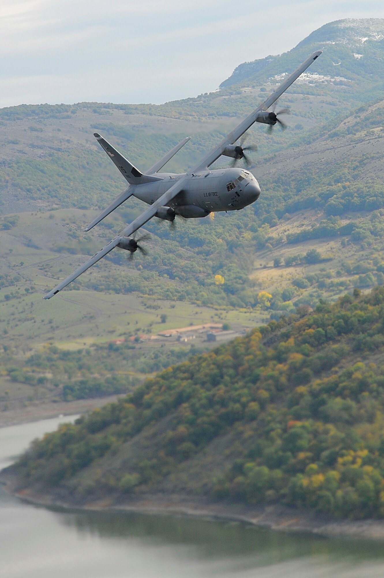 A C-130J Super Hercules assigned to the 37th Airlift Squadron, Ramstein Air Base, Germany, conducts low-level flight training during Operation Thracian Fall 2011, Oct. 18, 2011 in Plovdiv, Bulgaria. OTF11 is off-station training designed to enhance interoperability between U.S. and Bulgarian Air Forces as well as build partnerships with paratroopers from both. (U.S. Air Force photo by Senior Airman Stephen J. Otero)
