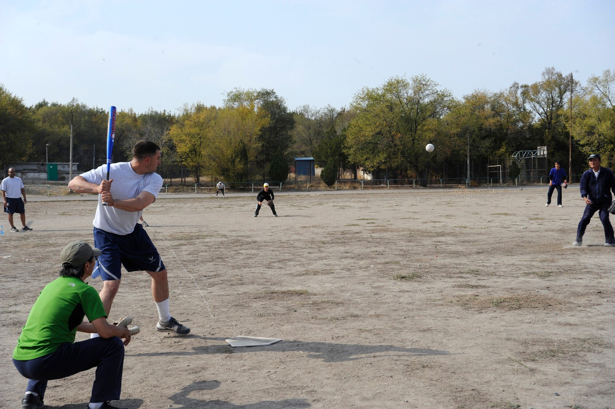 Staff Sgt. Evan Parrish waits for the ball during a softball tournament between Embassy personnel and Airmen deployed to the Transit Center at Manas, Kyrgyzstan, in Bishkek Oct. 15. Personnel from the U.S. and Japanese Embassies and Airmen deployed to the Transit Center participated in the tournament. The Transit Center team won. Parrish is a 376th Expeditionary Security Forces Squadron patrolman deployed from Travis Air Force Base, Calif. (U.S. Air Force photo/Staff Sgt. Patrick Maciejewski)