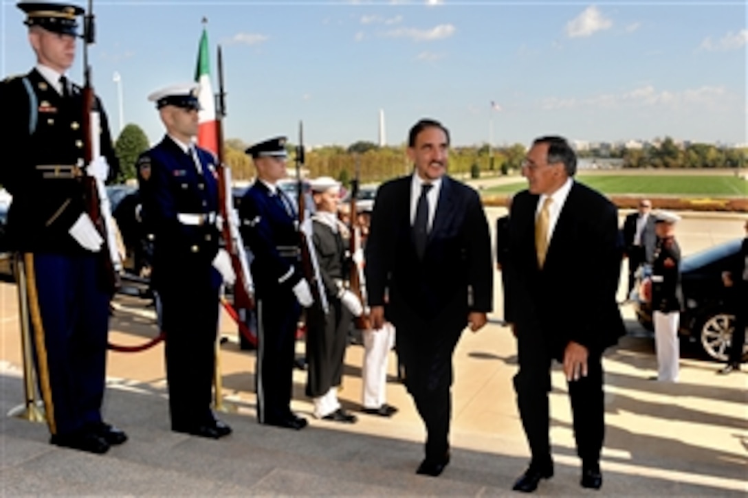 Secretary of Defense Leon E. Panetta, right, escorts Italian Minister of Defense Ignazio La Russa through an honor cordon and into the Pentagon in Arlington, Va., on Oct. 17, 2011.  Panetta and La Russa will meet during a working lunch to discuss security issues of interest to both nations.  