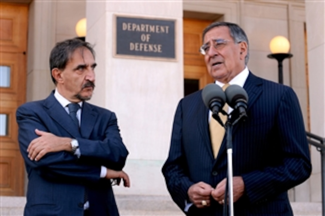 Secretary of Defense Leon E. Panetta, right, responds to a reporter's question during a media availability with Italian Defense Minister Ignazio La Russa, left, outside the Pentagon in Arlington, Va., on Oct. 17, 2011.  Panetta and La Russa met earlier for a working lunch to discuss security issues of interest to both nations.  