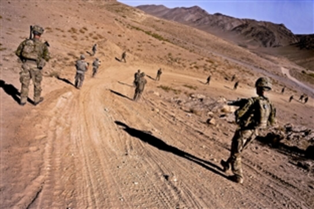 U.S. soldiers patrol to a village in the district of Mizan, Afghanistan, Oct. 17, 2011. The soldiers are assigned to the Provincial Reconstruction Team Zabul, Agribusiness Development Team, and 489th Civil Affairs Battalion. The team's mission is to conduct civil-military operations in Zabul province to extend the reach and legitimacy of the Afghan government.