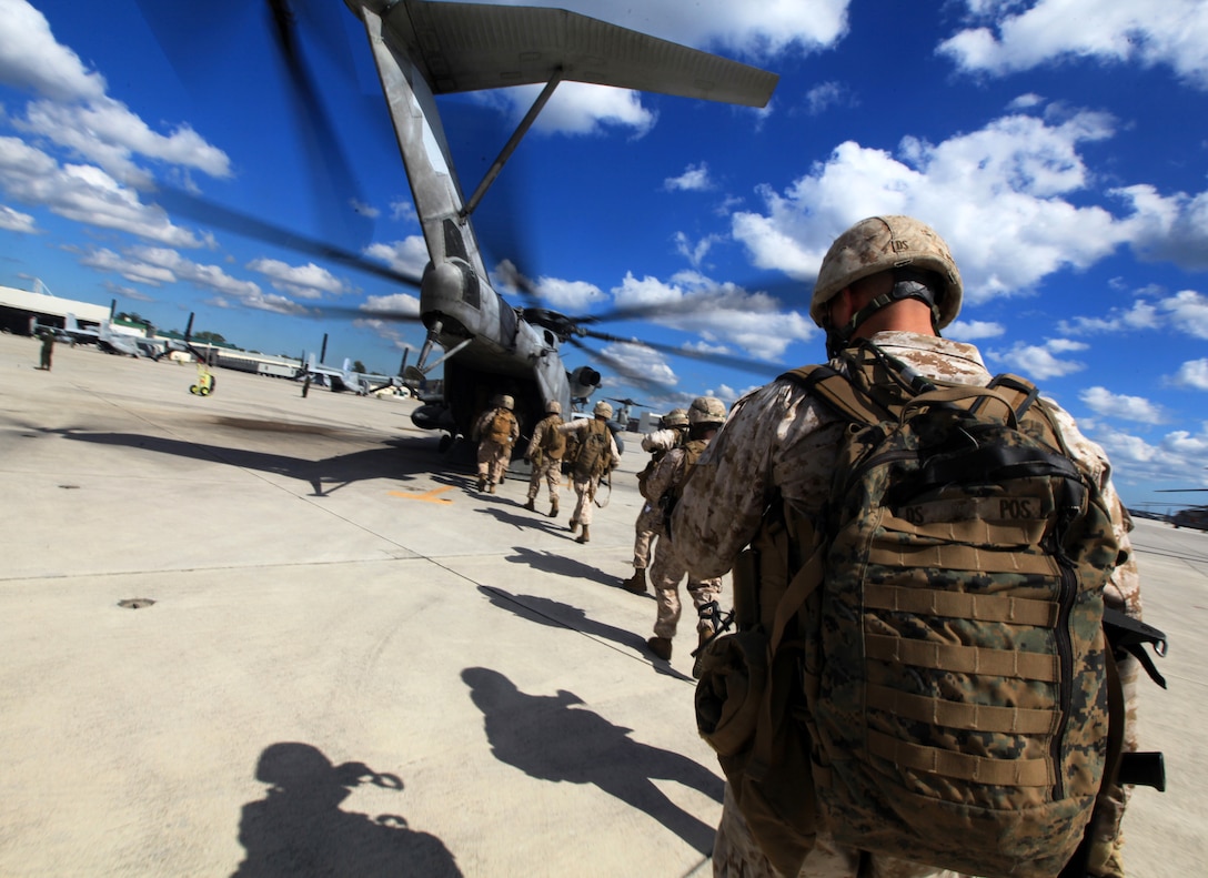 U.S. Marines with Bravo Company, 1st Battalion, 2nd Marine Regiment, board a CH-53E Super Stallion at Marine Corps Air Station New River prior to conducting a practice raid during the Vertical Assault Course aboard Camp Lejeune, N.C., Oct. 18, 2011. The Vertical Assault Course took place Oct. 10-21 to provide Marines and Sailors of Bravo Co. familiarization with air operations for their upcoming deployment as part of the Battalion Landing Team for the 24th Marine Expeditionary Unit.