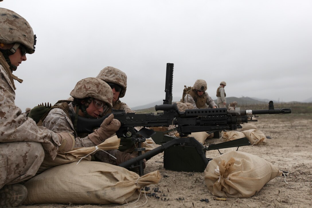 Marines with Female Engagement Team 12-1 familiarize themselves with the M-240B during pre-deployment training at Camp Pendleton, Calif., Oct. 19. The FET will also train with the M-16 and other machine guns.