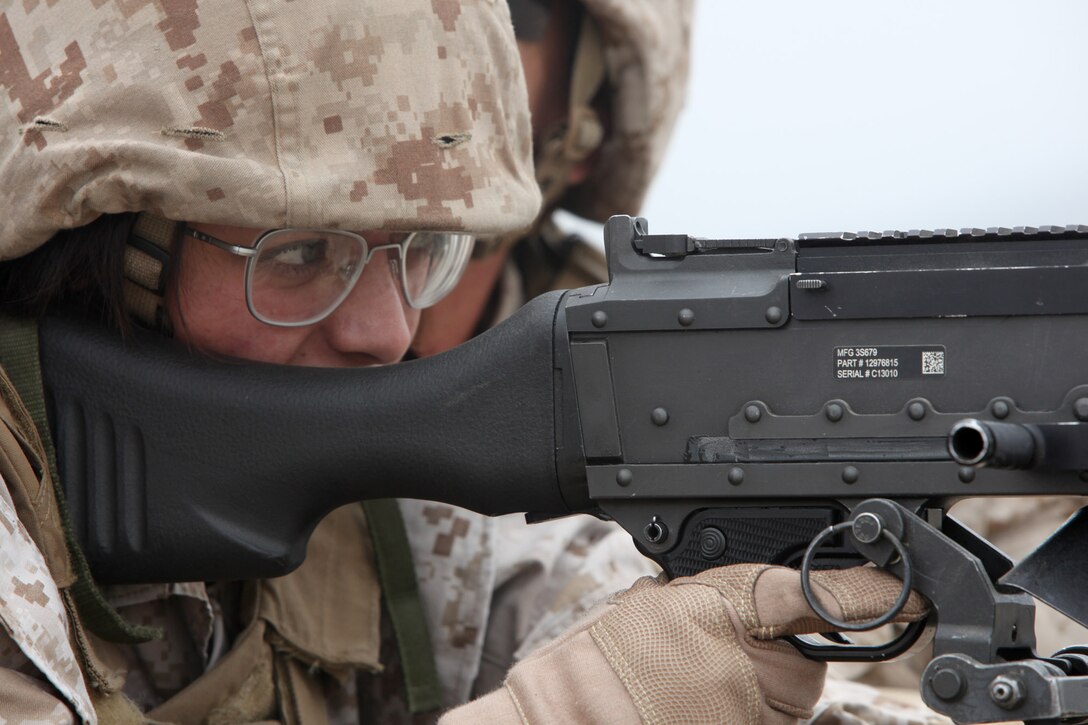 Lance Cpl. Rachel Bartlett, a 21-year-old team member from Florence, Ore., with Female Engagement Team 12-1 prepares to fire an M-240B during a familiarization exercise with crew-served weapons at Camp Pendleton, Calif., Oct. 19.