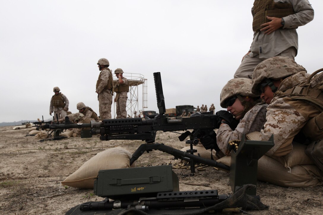 Marines with Female Engagement Team 12-1 familiarize themselves with the M-240B during crew-served weapons training at Camp Pendleton, Calif., Oct. 19. The FET will undergo a variety of training evolutions including patrolling tactics and language training to prepare them for their deployment.