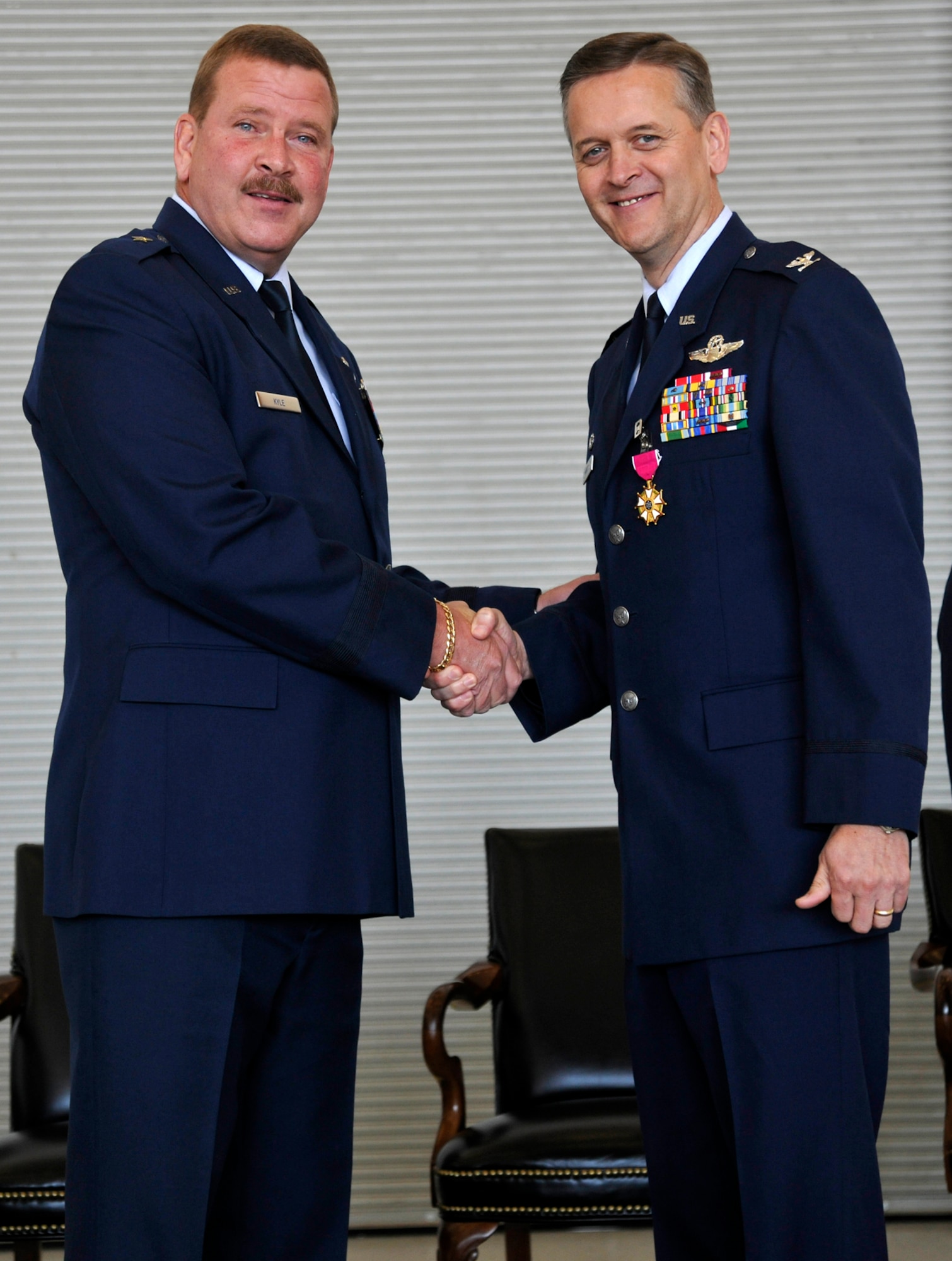 JOINT BASE ANDREWS, Md. -- Brigadier General Mark Kyle (left), 4th Air Force commander, presents the Legion of Merit medal to Col. Russell Muncy, former 459th Air Refueling Wing commander, during a change of command ceremony here Oct. 15. Leadership of the 459th ARW has been passed to Col. Samuel Mahaney, who comes to the wing from an operations group commander position at Westover Air Reserve Base, Mass. (U.S. Air Force photo/Airman First Class Lindsey Beadle)