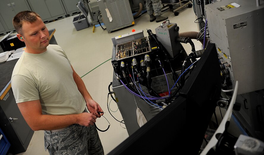 U.S. Air Force Staff Sgt. Douglas Cummings, 18th Component Maintenance Squadron avionics intermediate shop technician, , performs an operations check on a mid-to-low band signal router on Kadena Air Base, Japan, Oct. 18. The avionics flight provides support to all Kadena Air Base and visiting U.S. Air Force F-15 Eagle fighter jets. (U.S. Air Force photo/Staff Sgt. Christopher Hummel)