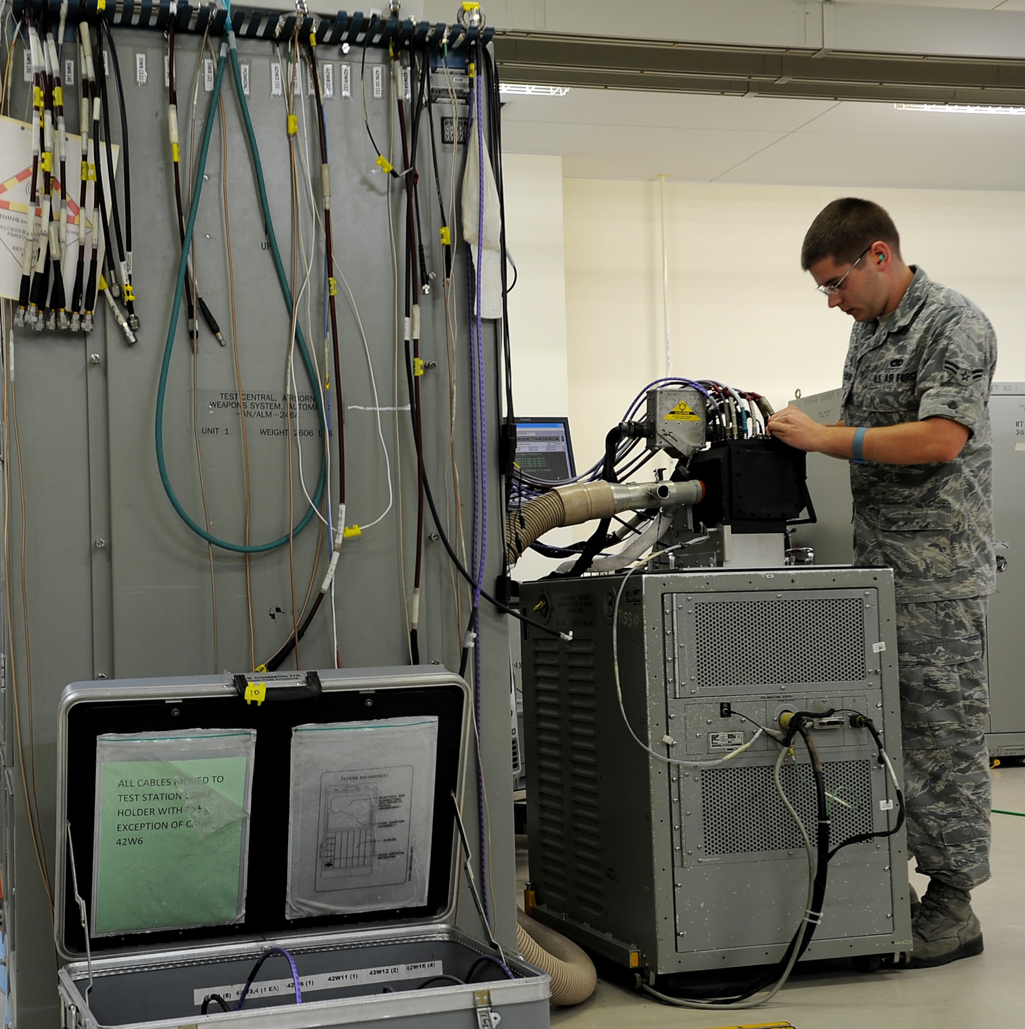 U.S. Air Force Airman 1st Class Zachary Brissey-Dowd, 18th Component Maintenance Squadron avionics intermediate shop technician,, performs an operations check on line replacement unit C-6 on Kadena Air Base, Japan, Oct. 18. The avionics flight provides support to all Kadena Air Base and visiting U.S. Air Force F-15 Eagle fighter jets. (U.S. Air Force photo/Staff Sgt. Christopher Hummel)
