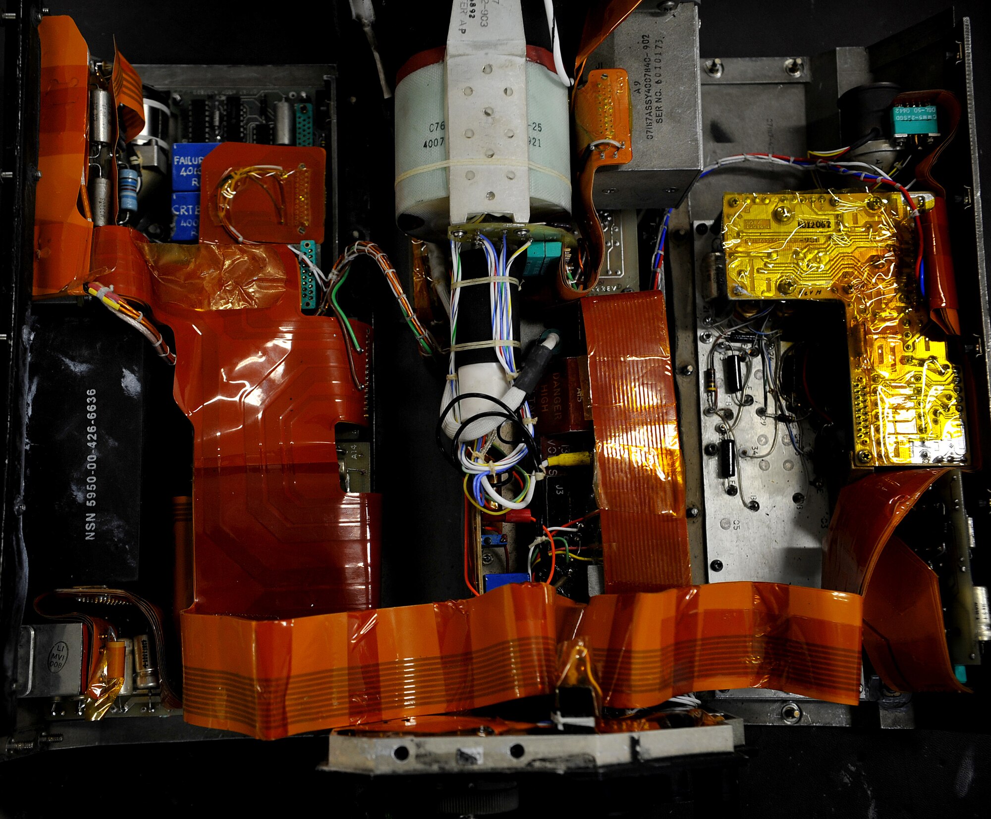 Technicians assigned to the 18th Component Maintenance Squadron avionics flight work on intricate electrical systems such as this air navigational multiple indicator, or ANMI, on Kadena Air Base, Japan, Oct. 18. ANMIs are used to display symbol and raster video signals on the aircraft. (U.S. Air Force photo/Staff Sgt. Christopher Hummel)
