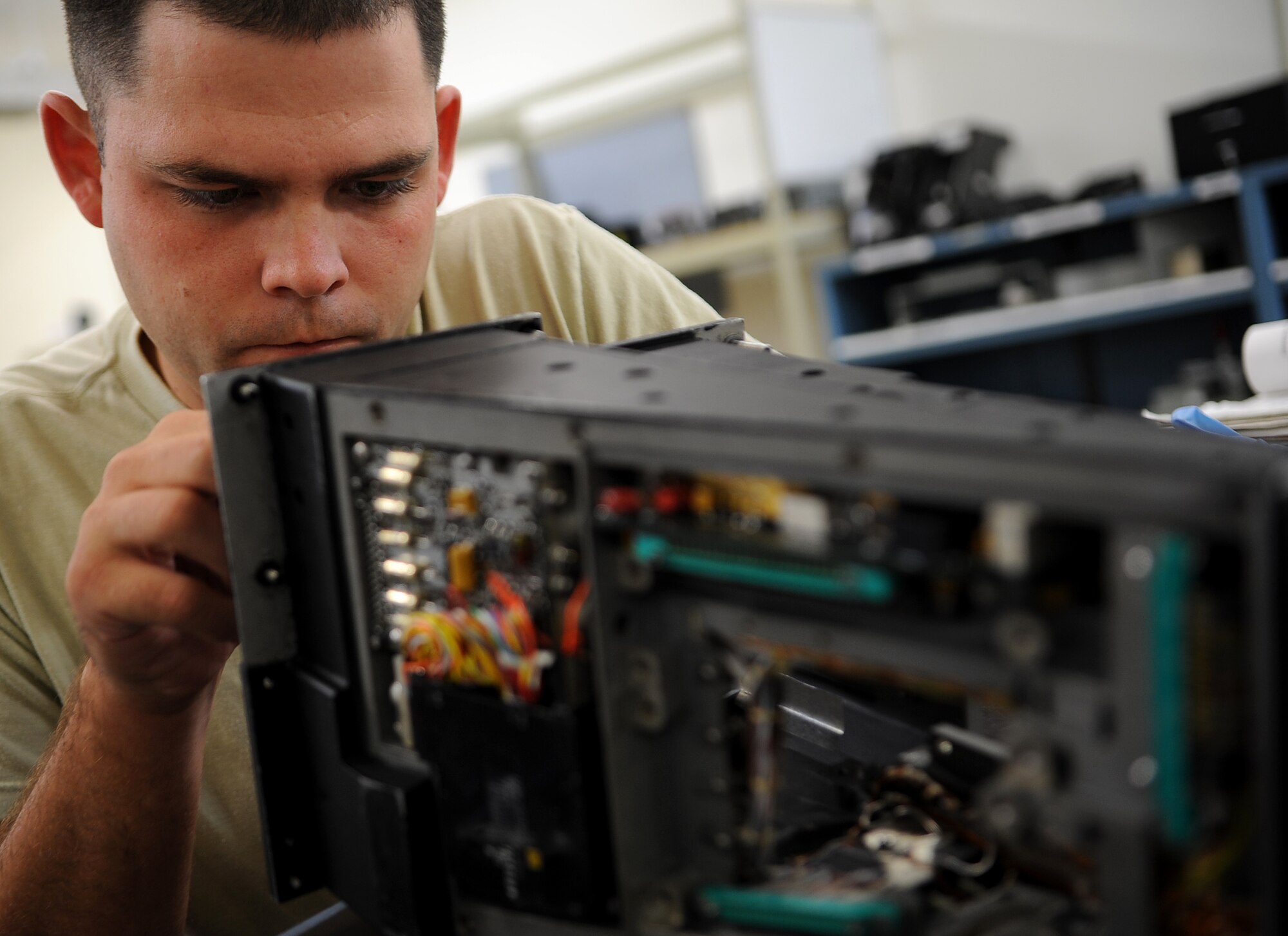 U.S. Air Force Senior Airman Jonathan Corbit, 18th Component Maintenance Squadron avionics intermediate shop technician, replaces a faulty relay on a U.S. Air Force F-15 Eagle fighter jet heads up display on Kadena Air Base, Japan, Oct. 18. The avionics flight provides support to all Kadena Air Base and visiting F-15's. (U.S. Air Force photo/Staff Sgt. Christopher Hummel)