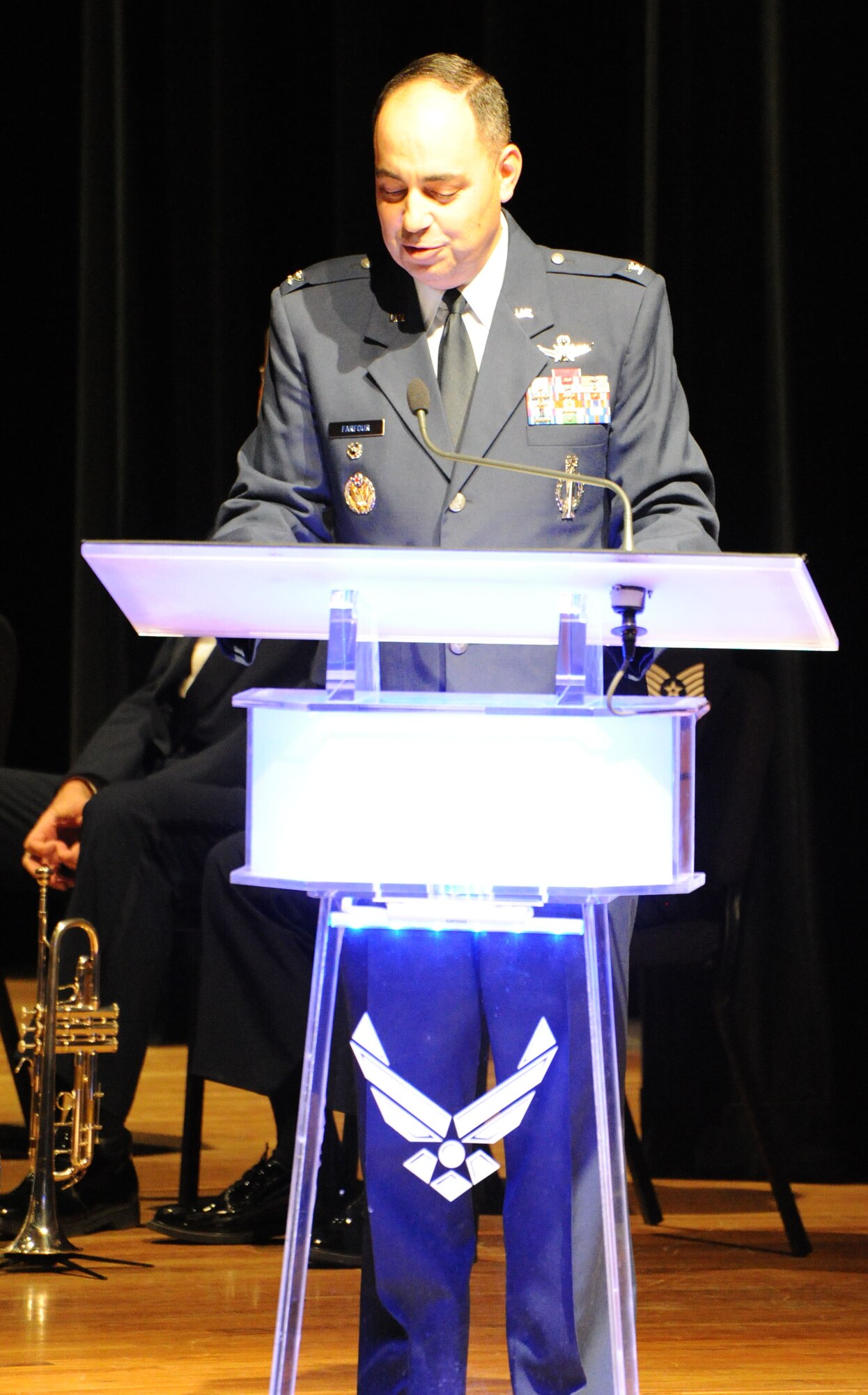 Col. George Farfour, 90th Missile Wing vice commander, F.E. Warren Air Force Base, Wy., speaks to the U.S. Air Force Band's audience Oct. 18 at the Cheyenne Civic Center, Cheyenne, Wy. The USAF Band is on their 25-day community relations tour across Montana, Wyoming, Nebraska and South Dakota. Servicemembers and veterans from the base and local community came to the show to enjoy a night of free entertainment. (U.S. Air Force photo by Airman 1st Class Tabitha N. Haynes)