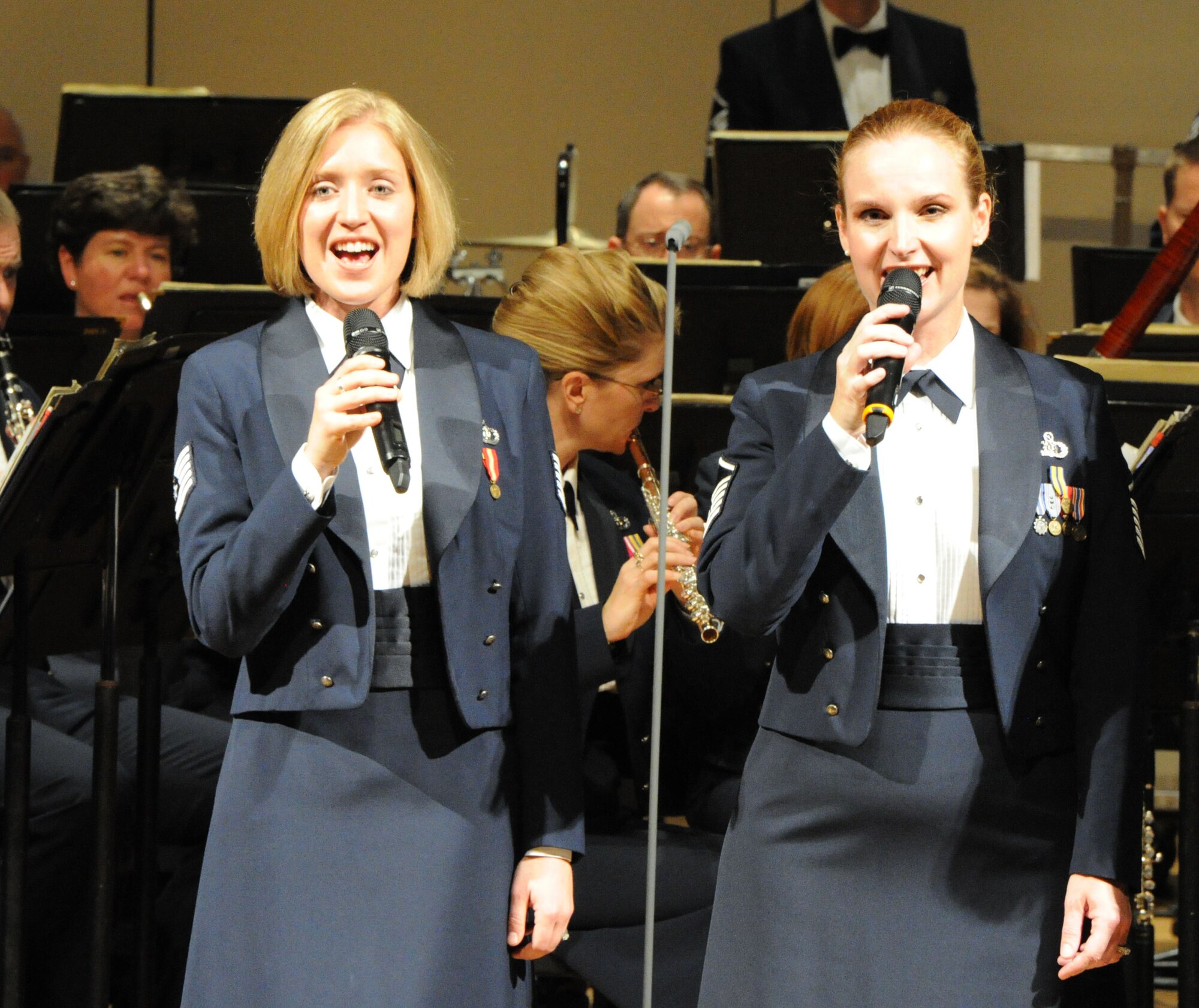 Tech. Sgt. Mandi Harper and Master Sgt. Anne Baker, U.S. Air Force Band Singing Sergeants, perform the "country medley" Oct. 18 at the Cheyenne Civic Center, Cheyenne, Wy., on the USAF Band's 2011 Fall Tour. The USAF Band is on their 25-day community relations tour across Montana, Wyoming, Nebraska and South Dakota. (U.S. Air Force photo by Airman 1st Class Tabitha N. Haynes)