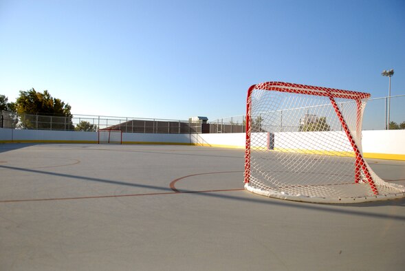 Part of the Airman's Campus, the new roller hockey rink is available for Airmen to use anytime. Lights around the rink allow for day or night games and equipment is available to check out from the Rosburg Fitness Center. Equipment includes full goalie gear, hockey sticks and roller hockey ball. Although furnished with roller hockey flooring, the rink is suitable for sneakers. For more information on the facility, equipment useage or the Sports Advisory Council, please contact Steve Lowe, Rosburg Fitness Center sports director, at 661-275-4967. (Air Force photo by Kate Blais)