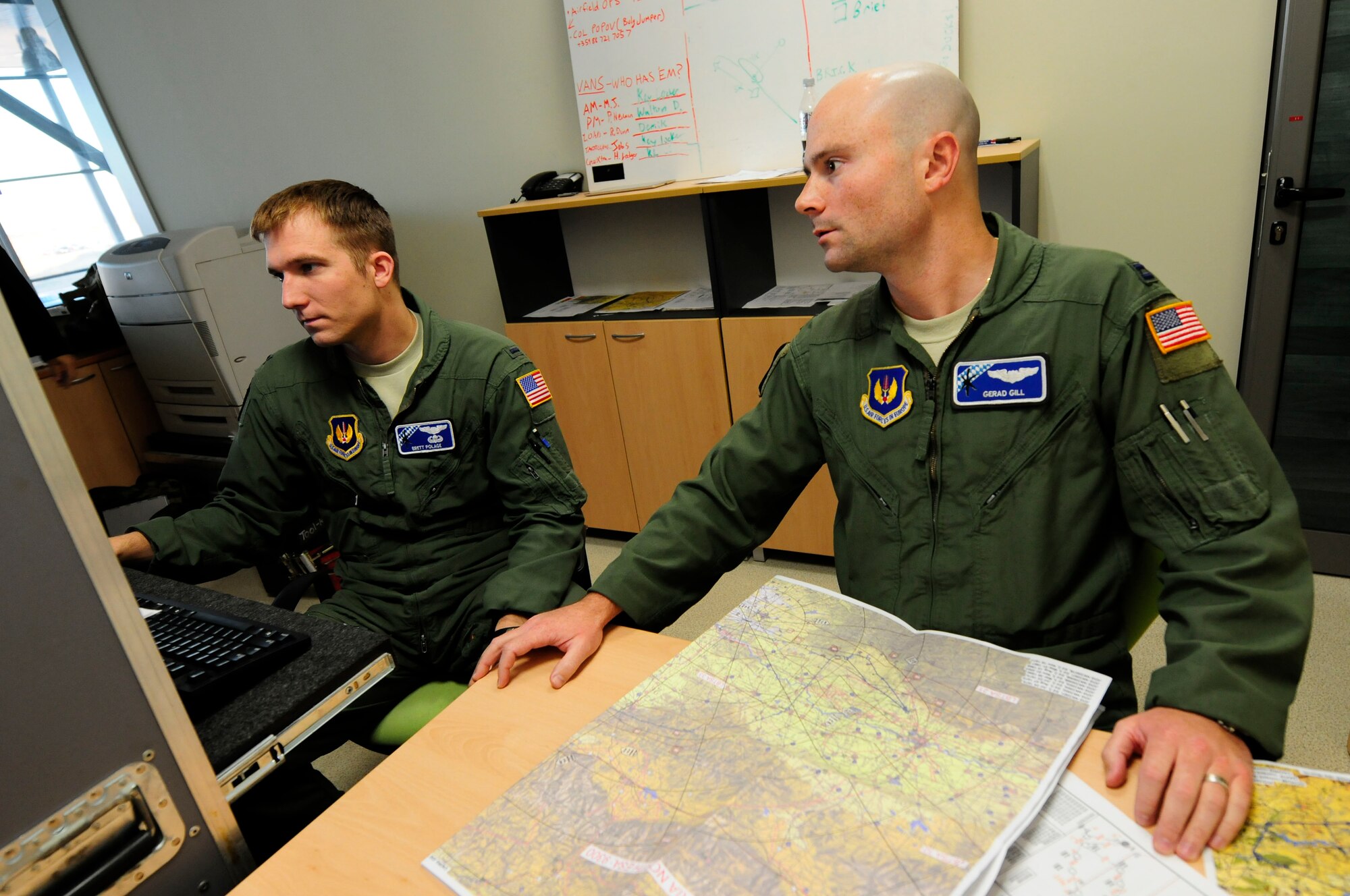 Capt. Gerad Gill, chief of tactics for Operation Thracian Fall 2011 develops a a flight plan with 1st Lt. Brett Polage, OTF11 tactics officer, at Plovdiv Airport in Bulgaria Oct. 19, 2011. OTF11 is an off-station training exercise designed to enhance interoperability between U.S. and Bulgarian Air Forces as well as build partnerships with paratroopers from both.  (U.S. Air Force photo by Staff Sgt. Travis Edwards)