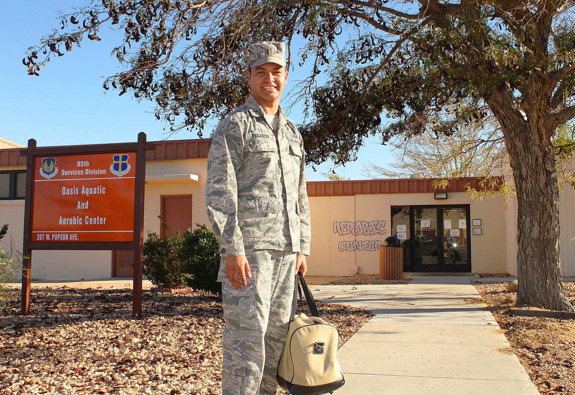 2nd Lieutenant Brian Figueroa, Instrumentation Flight Test Engineer, 412th Test Engineering Group, enters the Oasis Aquatic and Aerobic Center here. The center is conveniently located within the Airman's Campus next to the fitness and community centers. Offering fitness classes, an indoor swimming pool, and massage therapy, Airmen are encouraged to visit and take advantage of the health and wellness opportunities offered by the 95th Force Support Squadron. (U.S. Air Force photo by Meredith Mingledorff)
