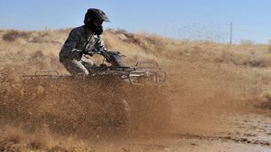 Capt. Matthew Brill, 366th Security Forces Squadron operations officer, drives through a mud puddle during an ATV safety course Oct. 14, 2011, at Mountain Home Air Force Base, Idaho. During the August wildfires here, 366th SFS personnel used ATV’s to access remote parts of the installation that were damaged. (U.S. Air Force photo by Airman 1st Class Heather Hayward)