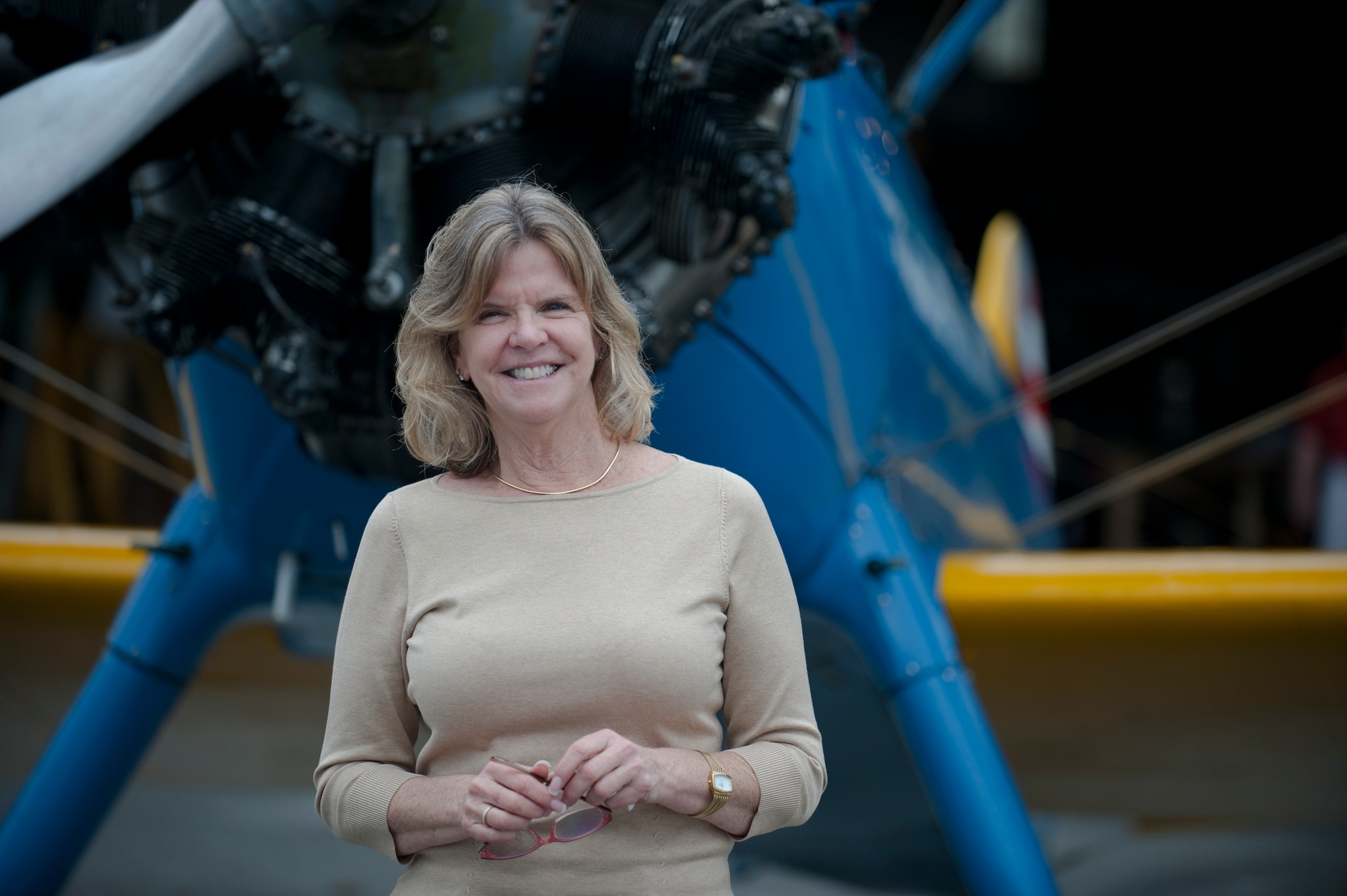 Jonna Doolittle Hoppes, granddaughter of Gen. James “Jimmy” Doolittle, poses in front of a PT-17 Stearman trainer aircraft at the 2011 reunion of the 63rd Flying Training Detachment in Douglas, Ga., Oct. 18, 2011. General Doolittle was an aviation pioneer, who is best known for the Doolittle Raid in which he led a flight of 16 B-25 Mitchell medium bombers during an attack on Japan April 18, 1942.  (U.S. Air Force photo by Airman 1st Class Jarrod Grammel/Released)
