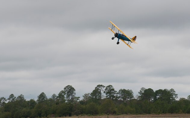 Jonna Doolittle Hoppes, granddaughter of Gen. James “Jimmy” Doolittle, rides in a PT-17 Stearman above World War II veterans during the 2011 reunion of the 63rd Flying Training Detachment in Douglas, Ga., Oct. 18, 2011. Members of the detachment used the Stearman as their primary training aircraft during the WWII era. (U.S. Air Force photo by Airman 1st Class Jarrod Grammel/Released)
