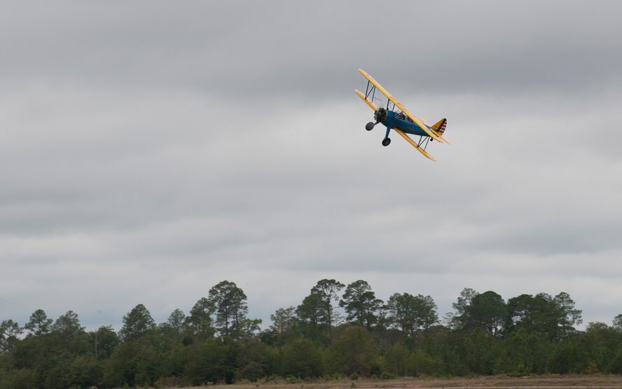 Jonna Doolittle Hoppes, granddaughter of Gen. James “Jimmy” Doolittle, rides in a PT-17 Stearman above World War II veterans during the 2011 reunion of the 63rd Flying Training Detachment in Douglas, Ga., Oct. 18, 2011. Members of the detachment used the Stearman as their primary training aircraft during the WWII era. (U.S. Air Force photo by Airman 1st Class Jarrod Grammel/Released)
