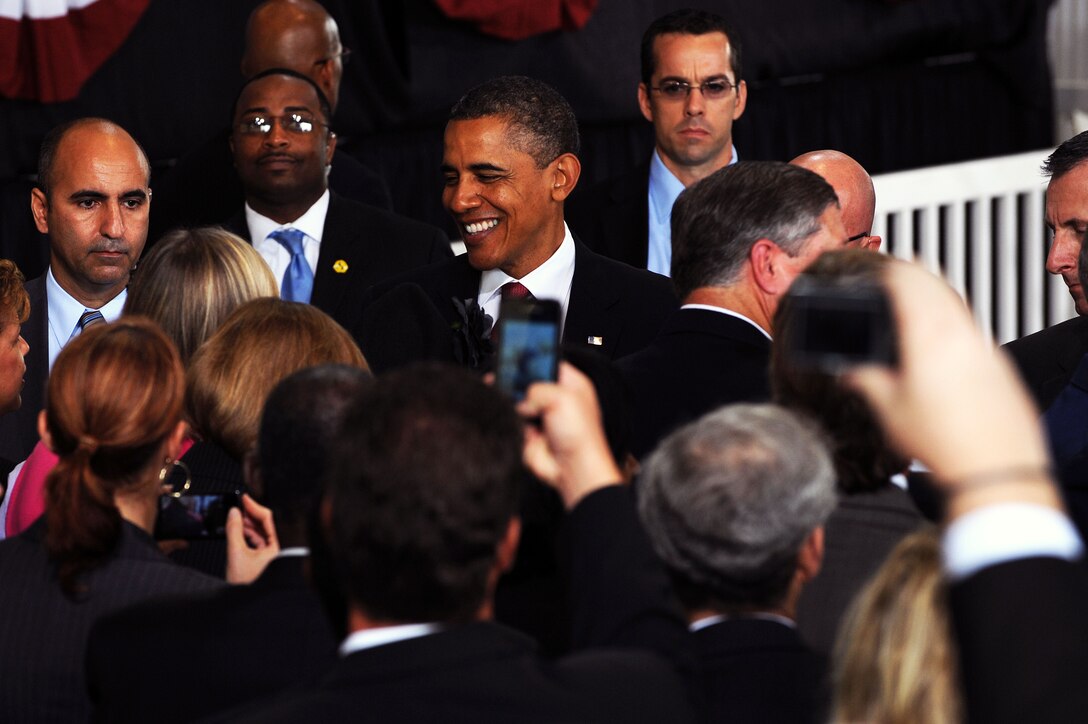 President Barack Obama shakes hands with invited guests during his visit to Langley Air Force Base, Va., Oct. 19, 2011. President Obama expressed his support for the 3 million servicemembers who have returned to civilian life over the past decade; and shared his plan to create roughly 25,000 jobs for veterans, and their spouses, over the next two years. (U.S. Air Force photo by Tech. Sgt. Christina M. Styer/Released)         