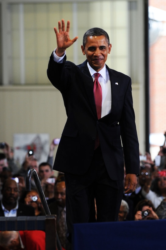 President Barack Obama greets thousands of Langley’s finest gathered in the 94th Fighter Squadron’s hangar during his visit to Langley Air Force Base, Va., Oct. 19, 2011. The president and Mrs. Obama discussed the tireless effort of military spouses, supporting veterans and the American Jobs Act. (U.S. Air Force photo by Tech. Sgt. Christina M. Styer/Released)    