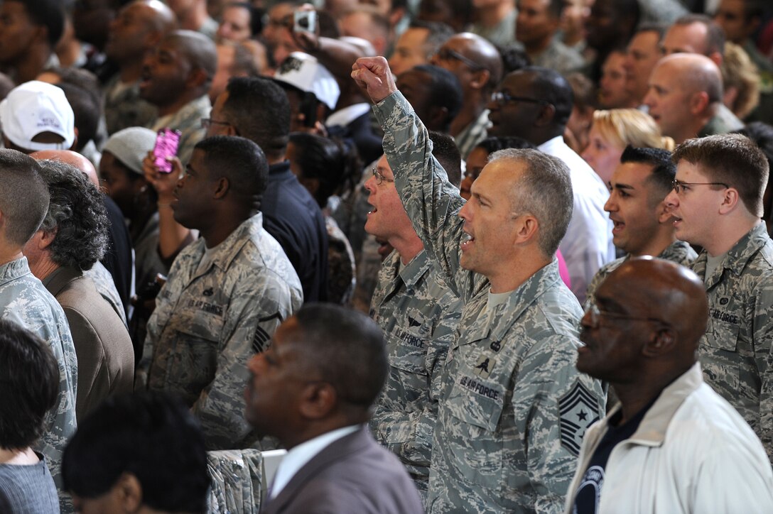 U.S. Air Force Command Chief Master Sgt. Martin S. Klukas, Air Combat Command, cheers during the singing of the Air Force song prior to the arrival of President Barack Obama at Langley Air Force Base, Va., Oct. 19, 2011. The president and first lady’s comments focused on the amazing abilities American veterans have to offer the civilian workforce. (U.S. Air Force photo by Tech. Sgt. Christina M. Styer/Released)  