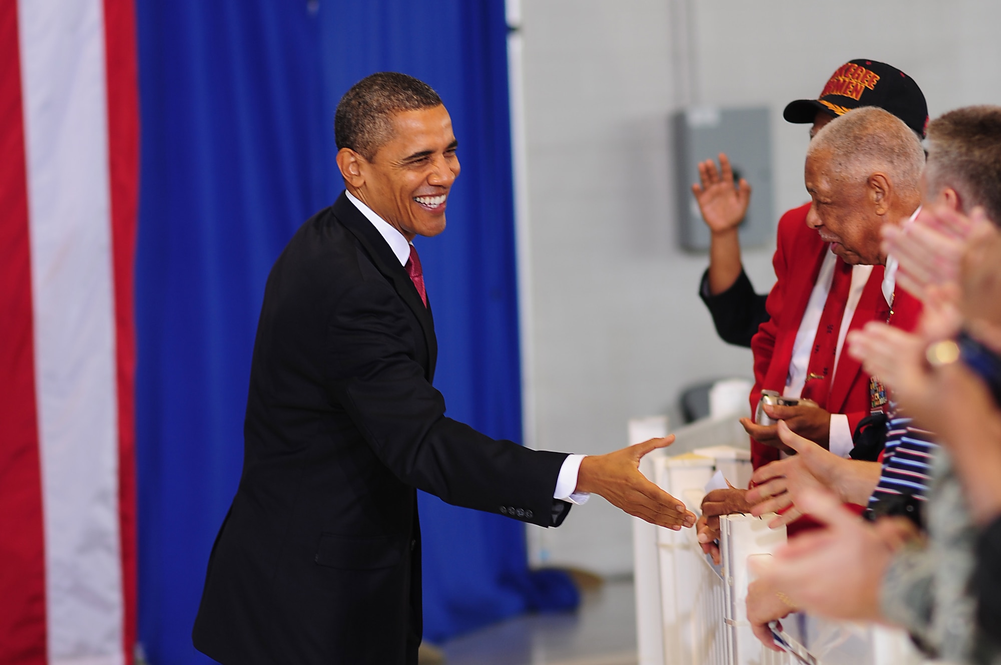 President Barack Obama greets an original Tuskegee Airman at Langley Air Force Base, Va., Oct. 19, 2011. The president visited Langley Air Force Base to encourage the entire nation to stand up for veterans. (U.S. Air Force photo by Staff Sgt.Antoinette Gibson /Released) 
