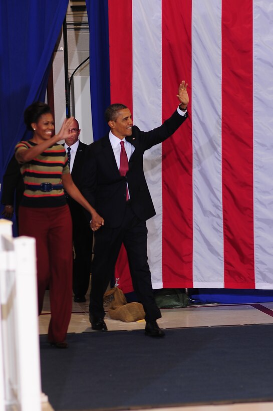 President Barack Obama and First Lady Michelle Obama wave to the crowd during their visit to Langley Air Force Base, Va., Oct. 19, 2011. Hampton Roads was the fifth stop of Obama’s three-day bus tour promoting the American Jobs Act. (U.S. Air Force photo by Staff Sgt.Antoinette Gibson /Released) 