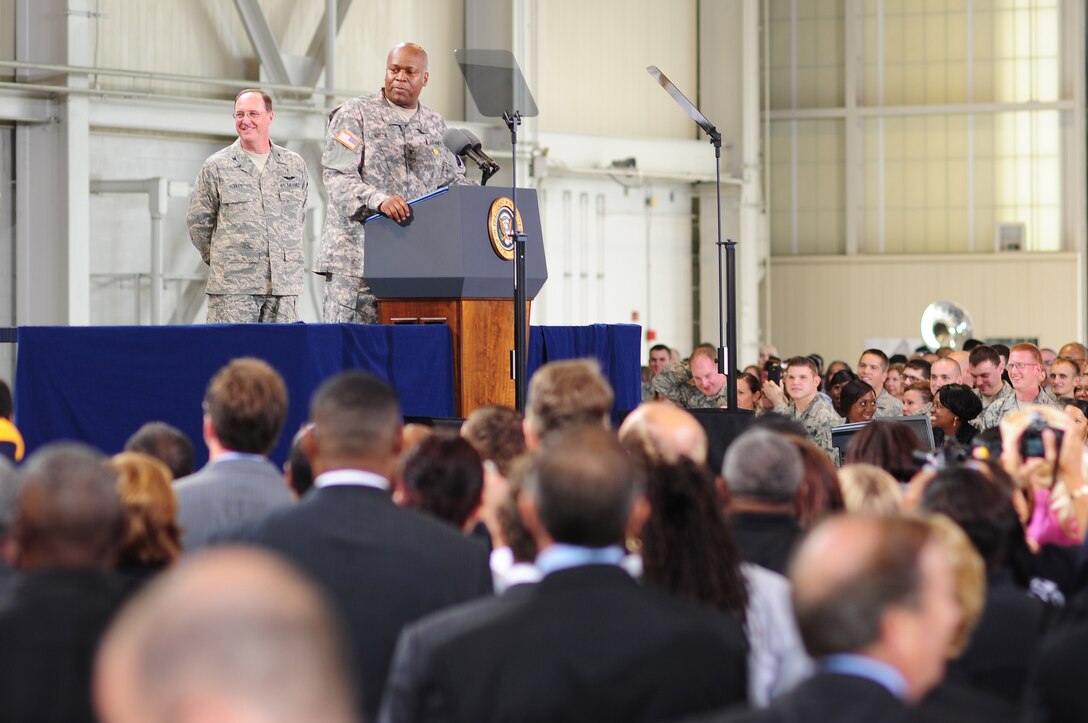 U.S. Army Col. Reggie Austin, 633rd Air Base Wing vice commander, leads the Air Force song before the president addresses the crowd  at Langley Air Force Base, Va., Oct. 19, 2011. Obama said he hopes to create roughly 25,000 jobs for veterans, and their spouses, over the next two years. (U. S. Air Force photo by Staff Sgt.Antoinette Gibson /Released)