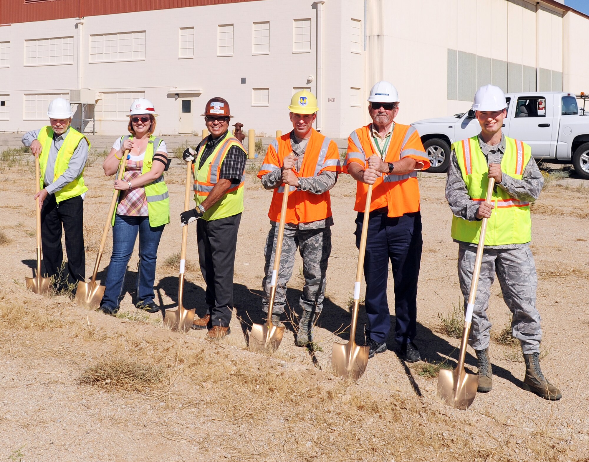Leaders break ground Oct. 11 on the future site of Air Force Research Laboratory's new 400-meter running track. From Left: David Zickafoose, AFRL Detachment 7 facility operations manager; Jacqueline Abbott, Army Corps of Engineers; Sammy Garcia, Granite Construction; Col. Michael Platt, AFRL Det 7 commander; Kenneth Crawford, 95th Air Base Wing Civil Engineering project manager; 1st Lt. Nicholas Kreitinger, AFRL Fitness Facility manager. The Office of the Secretary of Defense-funded project is part of OSD's fitness program initiative for projects at installations throughout the Air Force. (Air Force photo by Ron Fair)