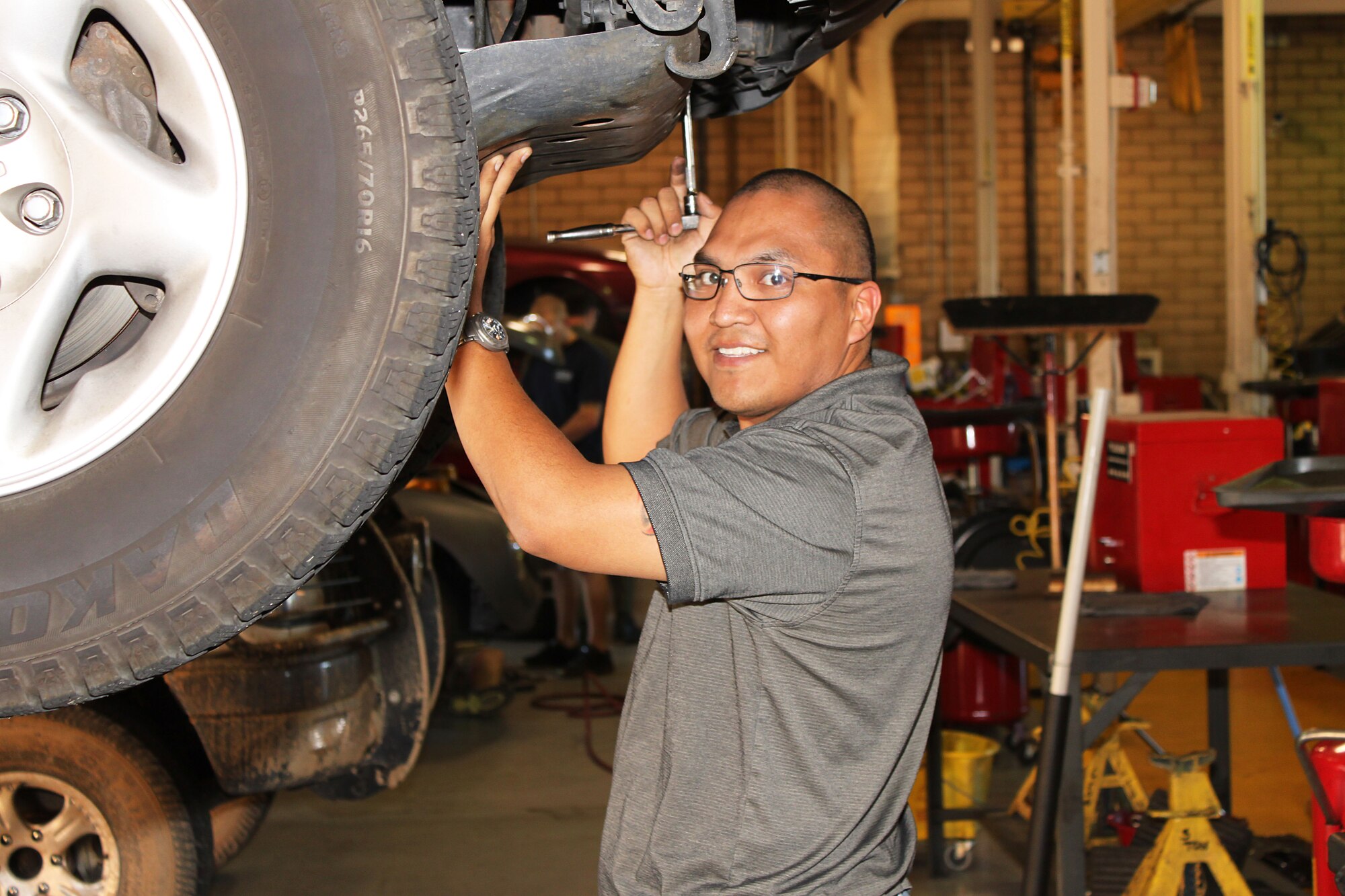 A member of the Edwards community works on his vehicle at the Auto Hobby Shop here. The shop is within walking distance from the dormitories and is open Tuesday - Saturday 9 a.m. -6 p.m. For more information call 661-275-2886. (U.S. Air Force Photo by Meredith Mingledorff) 