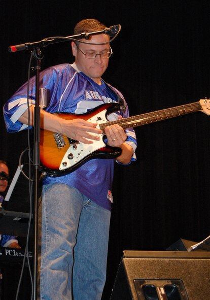 LAUGHLIN AIR FORCE BASE, Texas - Staff Sgt. Greg Lacy, United States Air Force Band of the West lead guitar player, performs a pop music number at the Paul Poag Theatre in Del Rio Oct.15. The free concert was open to the public as part of Fiesta de Amistad, a week-long event promoting friendship between the sister cities of Del Rio and Cuidad Acuna. (U.S. Air Force photo/Master Sgt. Peter Borys)