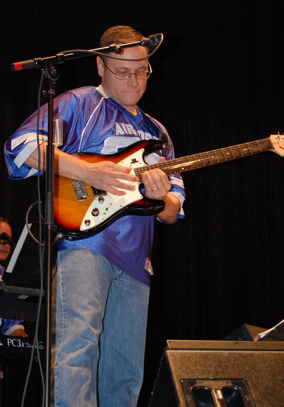 LAUGHLIN AIR FORCE BASE, Texas - Staff Sgt. Greg Lacy, United States Air Force Band of the West lead guitar player, performs a pop music number at the Paul Poag Theatre in Del Rio Oct.15. The free concert was open to the public as part of Fiesta de Amistad, a week-long event promoting friendship between the sister cities of Del Rio and Cuidad Acuna. (U.S. Air Force photo/Master Sgt. Peter Borys)