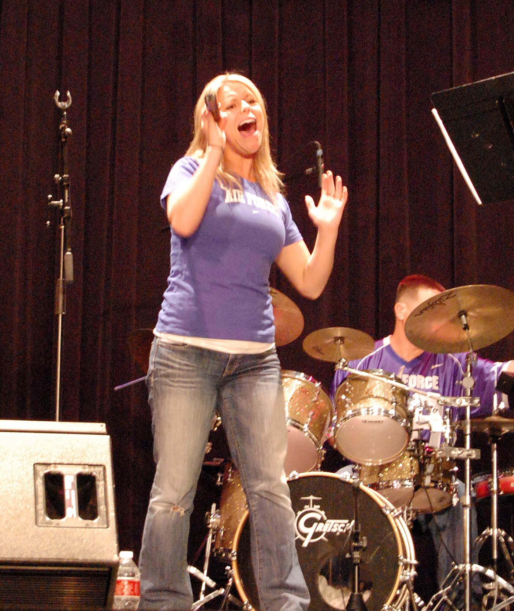 LAUGHLIN AIR FORCE BASE, Texas - Staff Sgt. Courtney Clifford, United States Air Force Band of the West vocalist, sings a country music number at the Paul Poag Theatre in Del Rio Oct.15. The free concert was open to the public as part of Fiesta de Amistad, a week-long event promoting friendship between the sister cities of Del Rio and Cuidad Acuna. (U.S. Air Force photo/Master Sgt. Peter Borys)