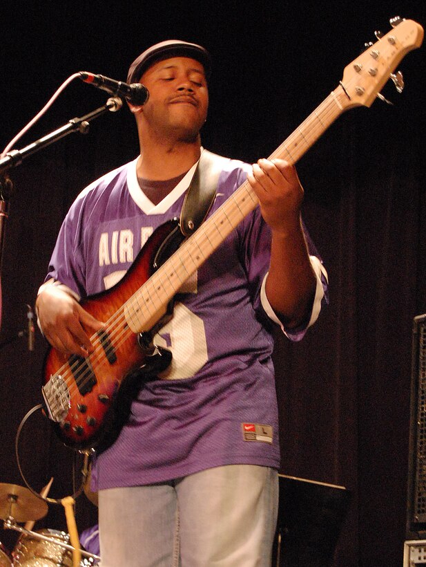LAUGHLIN AIR FORCE BASE, Texas - Senior Airman Henry Roberson, United States Air Force Band of the West bass guitar player, performs a country music number at the Paul Poag Theatre in Del Rio Oct.15. The free concert was open to the public as part of Fiesta de Amistad, a week-long event promoting friendship between the sister cities of Del Rio and Cuidad Acuna. (U.S. Air Force photo/Master Sgt. Peter Borys)