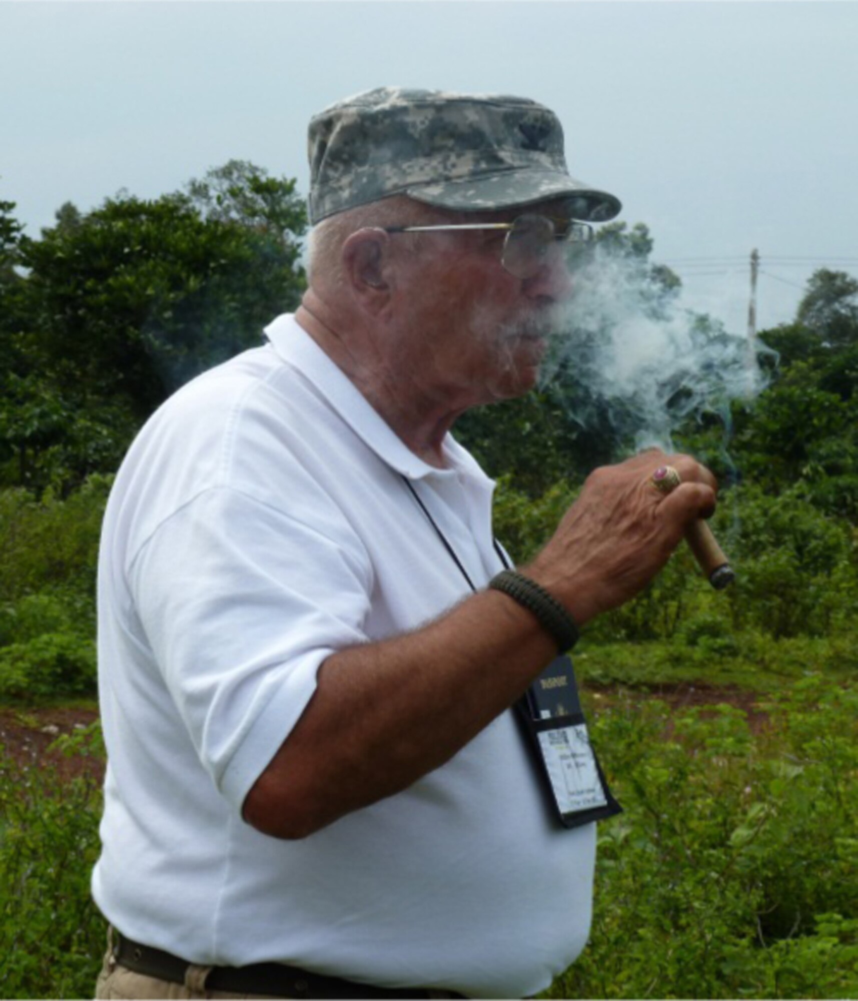 Air Force Reserve Command’s 34th Aeromedical Evacuation Squadron, Peterson Air Force Base, Colo. Honorary Commander retired Army Col. Bill McPherson, smokes a cigar in remembrance of his comrade, 22-year-old co-pilot, CW2 John Grow. After 45 years the colonel returned to his Huey gunship crash site in Vietnam that took the life of his co-pilot and left him with multiple gunshot scars. (Courtesy photo)  