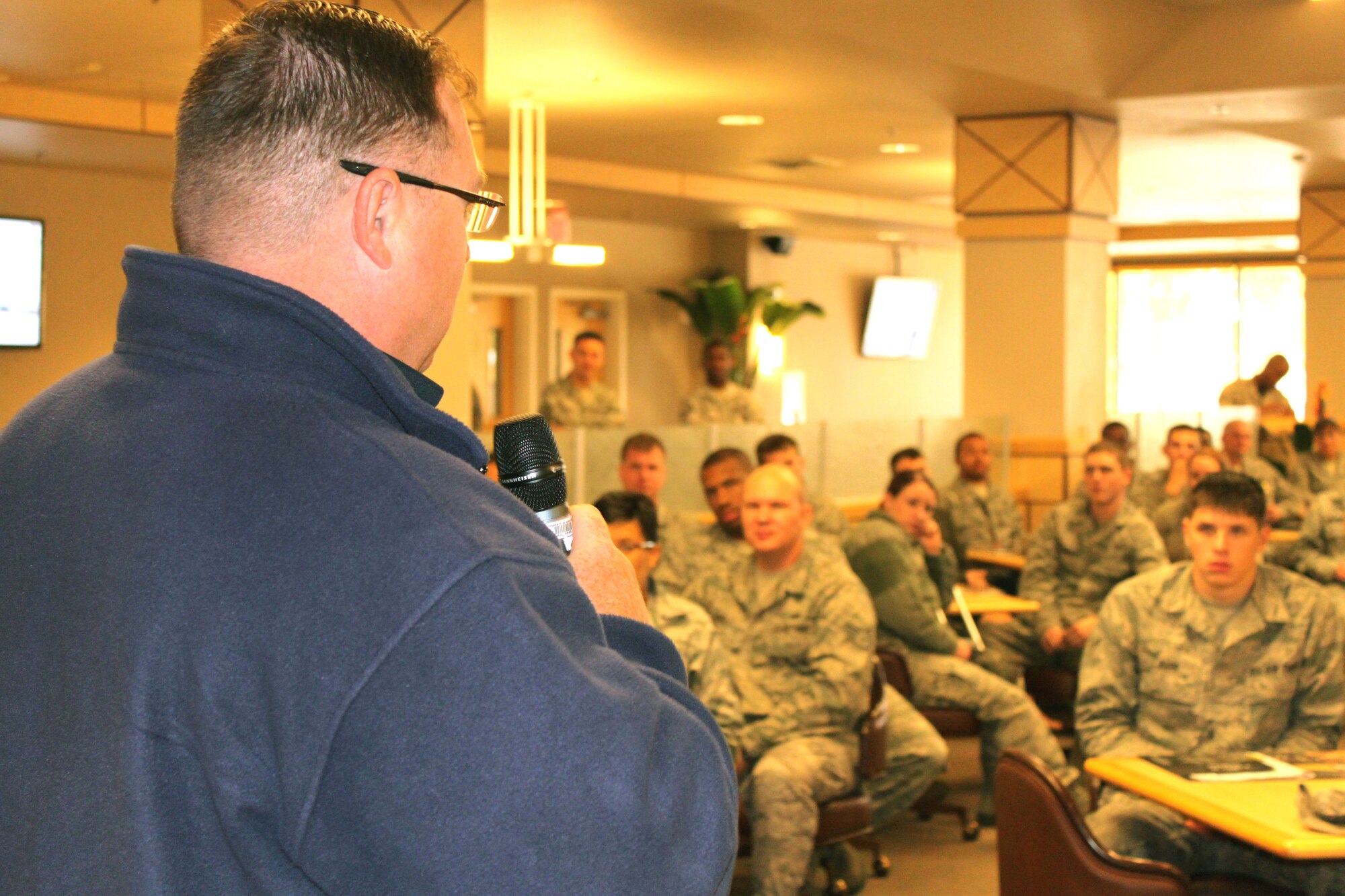 Pete Smith, Fitness Center Manager, 95th Force Support Squadron, explains services his unit offers within the Airman's Campus at Edwards during a townhall meeting for dorm residents Oct. 5. (U.S. Air Force Photo by Meredith Mingledorff) 