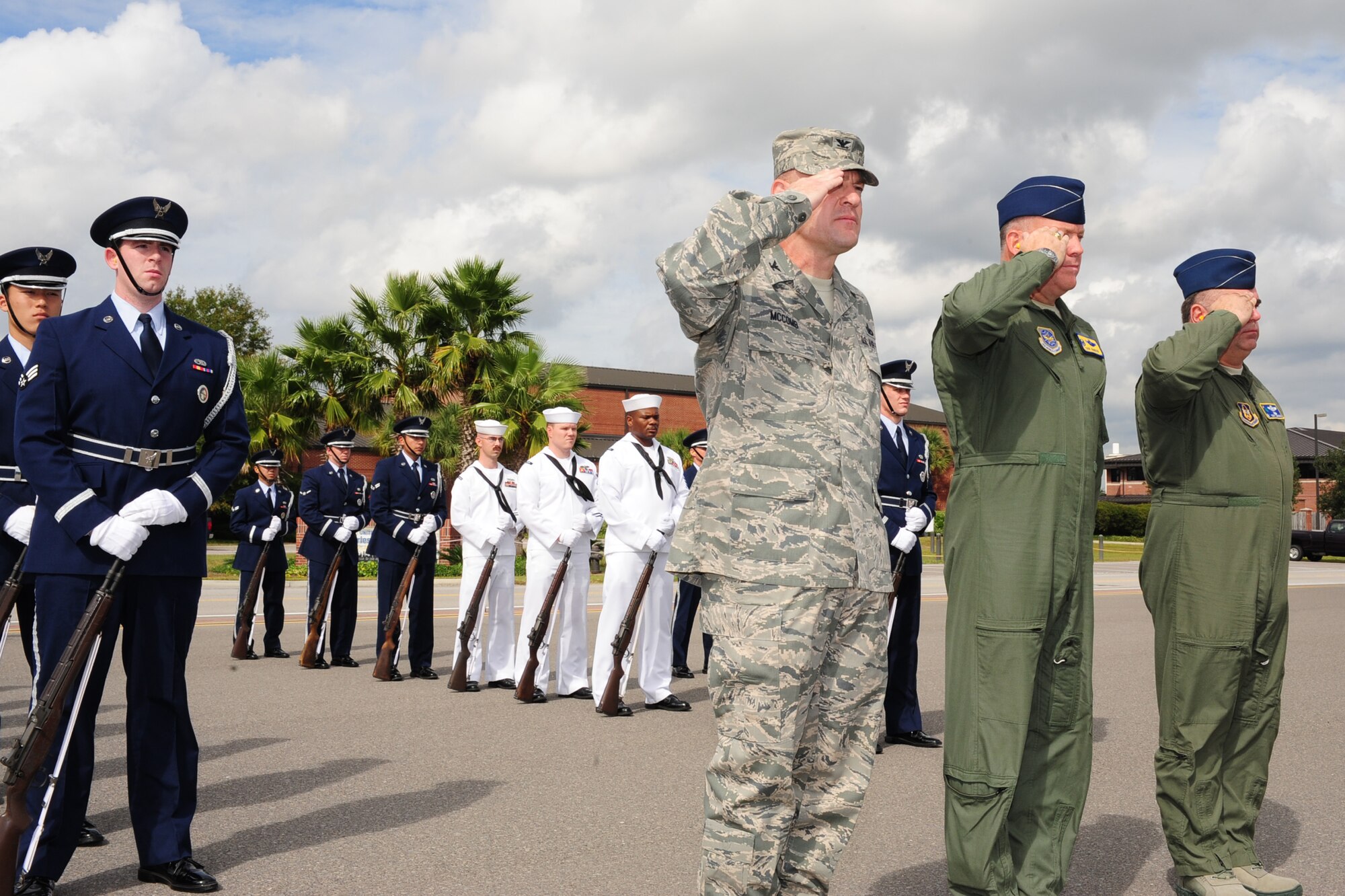 Colonel Richard McComb, Col. Erik Hansen and Col. Terry Lawrence, along with
the Joint Base Charleston Honor Guard team, salute Secretary of the Air Force Michael Donley as he arrives at Joint Base Charleston, S.C., Oct. 18. The Secretary of the Air Force is responsible for the affairs of the Department of the Air Force, including organizing, training, equipping and providing for the welfare of nearly 370,000 men and women on active duty, 180,000 members of the Air National Guard and the Air Force Reserve, and 160,000 civilians and their families. With an annual budget of approximately $119 billion, the secretary ensures the Air Force can meet its current and future operational requirements. McComb is the 628th Air Base Wing
Commander, Hansen is the 437th Airlift Wing Commander and Lawrence is the
315th Operations Group Commander. (U.S. Air Force photo/Tech. Sgt Chrissy
Best)
