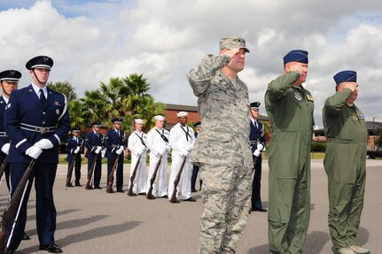 Colonel Richard McComb, Col. Erik Hansen and Col. Terry Lawrence, along with
the Joint Base Charleston Honor Guard team, salute Secretary of the Air Force Michael Donley as he arrives at Joint Base Charleston, S.C., Oct. 18. The Secretary of the Air Force is responsible for the affairs of the Department of the Air Force, including organizing, training, equipping and providing for the welfare of nearly 370,000 men and women on active duty, 180,000 members of the Air National Guard and the Air Force Reserve, and 160,000 civilians and their families. With an annual budget of approximately $119 billion, the secretary ensures the Air Force can meet its current and future operational requirements. McComb is the 628th Air Base Wing
Commander, Hansen is the 437th Airlift Wing Commander and Lawrence is the
315th Operations Group Commander. (U.S. Air Force photo/Tech. Sgt Chrissy
Best)
